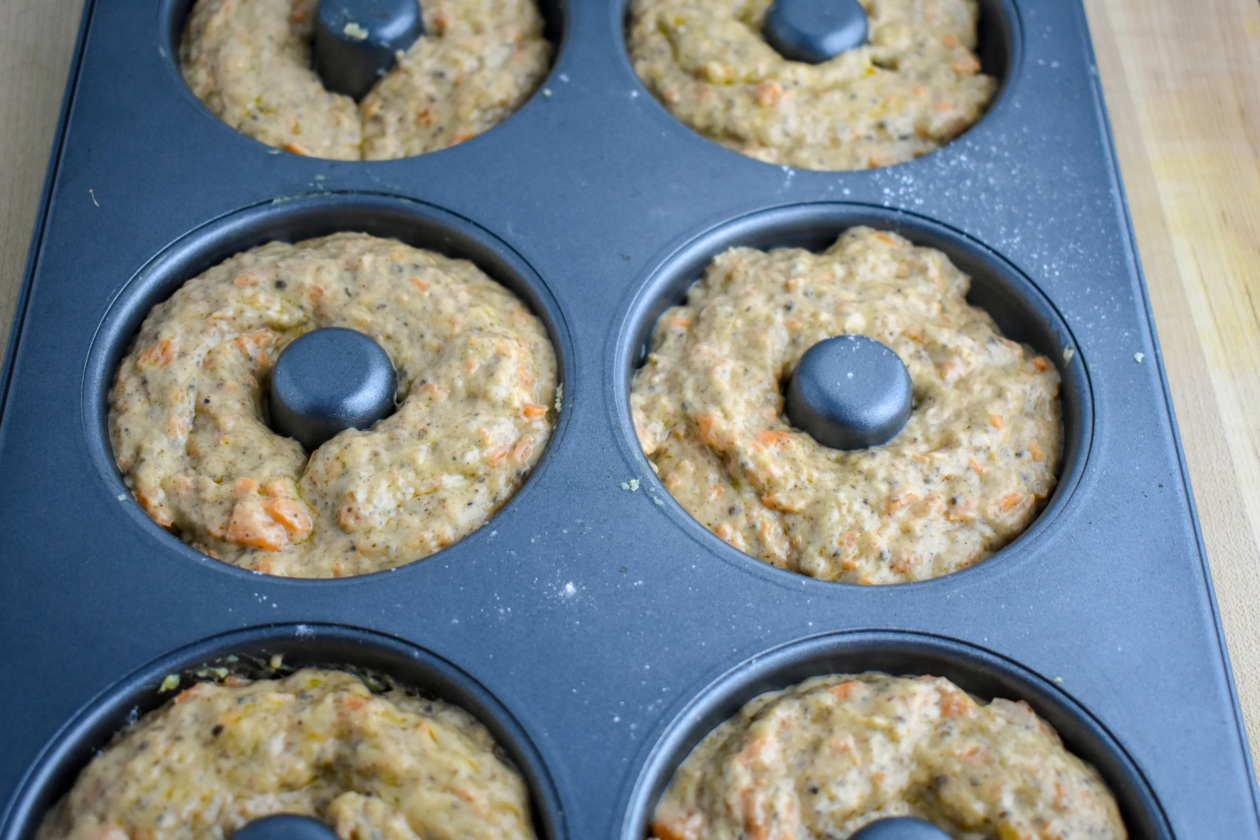5. Once filled, place the donuts in the oven and bake for 12-14 minutes (this varies on oven so watch closely) until the donut has firmed and started to brown slightly.