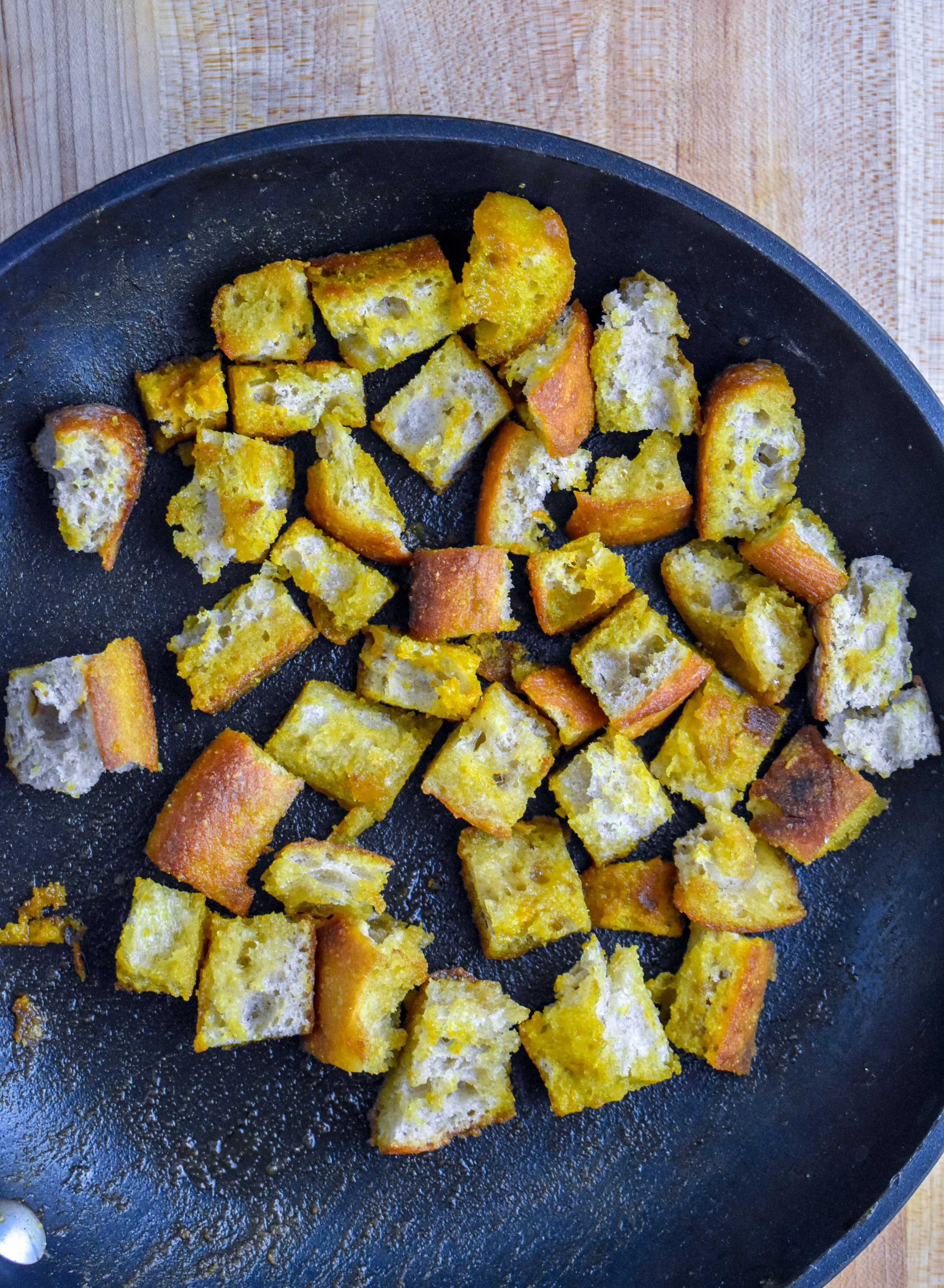 2. Once butter begins to pop, add the bread cubes, coat well and add spices. Cook 3-4 minutes over medium heat, flip cook another 3-4 minutes. Set aside.