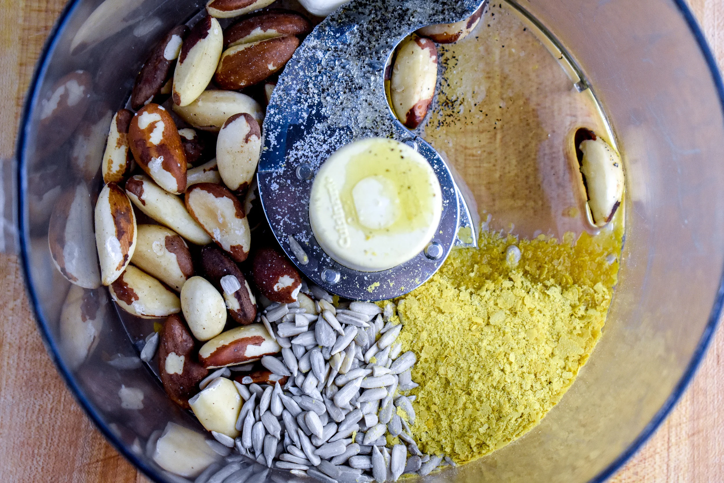 8. Clean out food processor or blender, add the parm ingredients to the food proccesor. Pulse 8-10 times until you have a crumble cheese texture.
