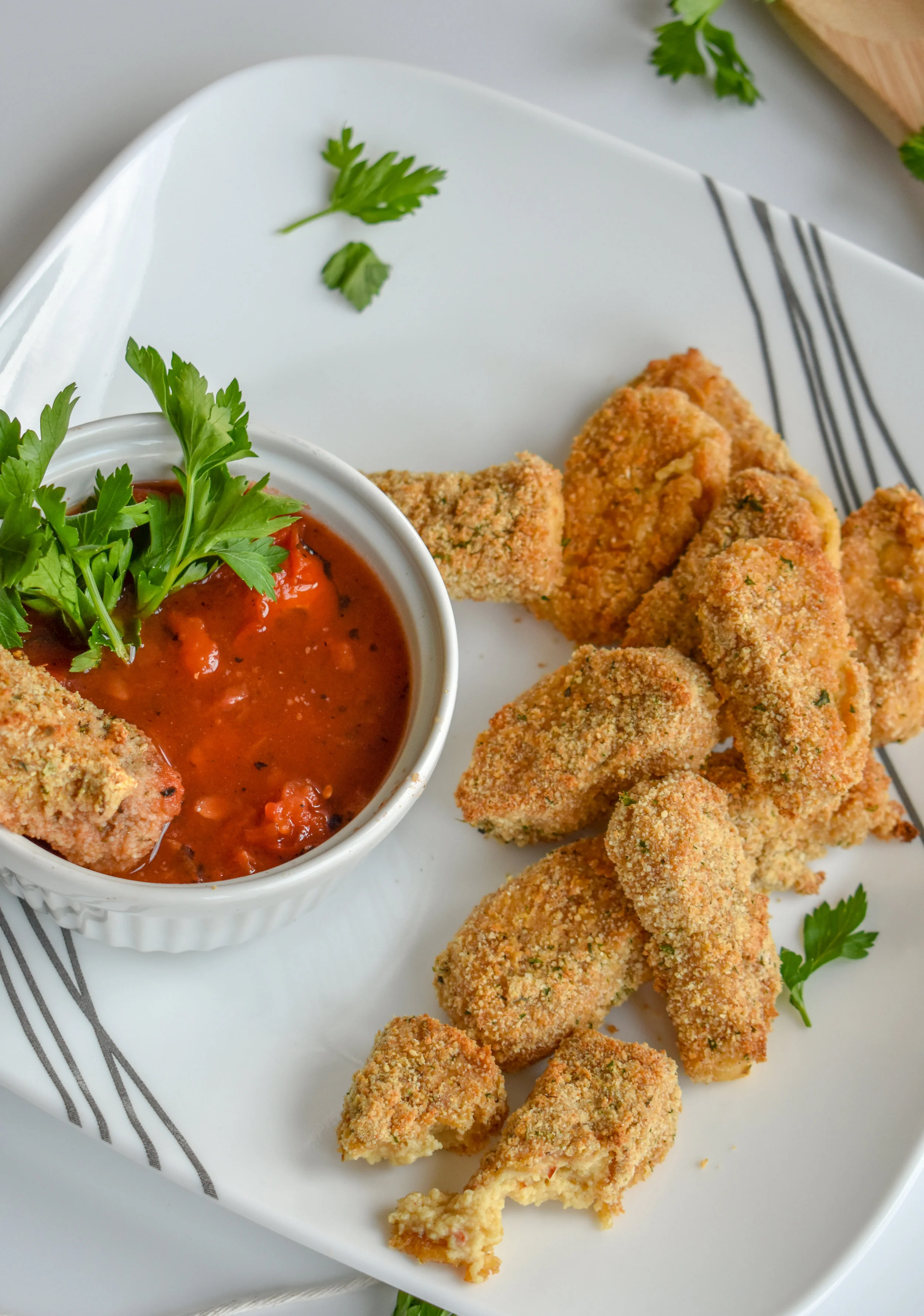 10. Serve the mozzarella sticks with a tomato sauce for dipping. Yum!