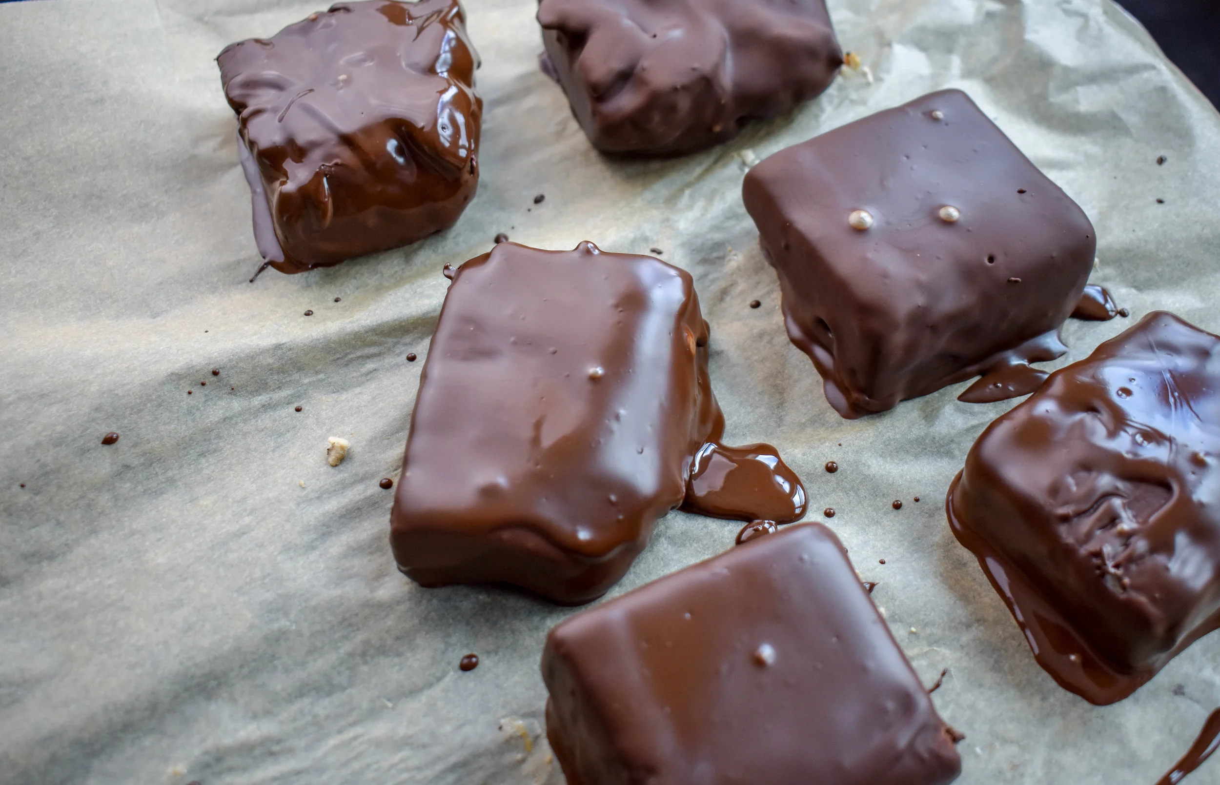 6. Once you have all squares covered and sitting on the parchment, place back into the freezer for 15-20 minutes.