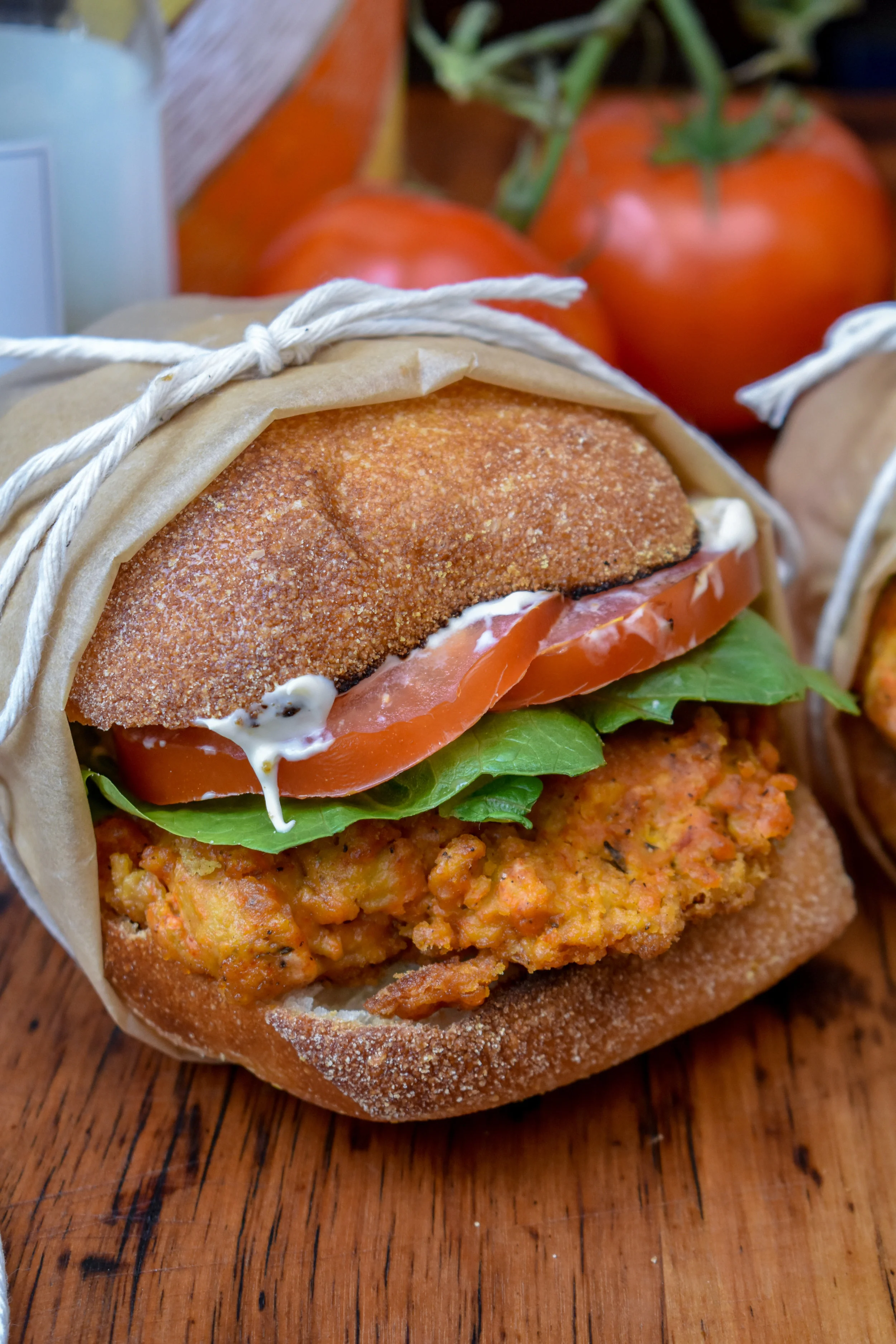 8. Lastly, place the patty between two halves fo a toasted ciabatta with some romaine lettuce, a couple tomato slices, and VEGAN MAYO!