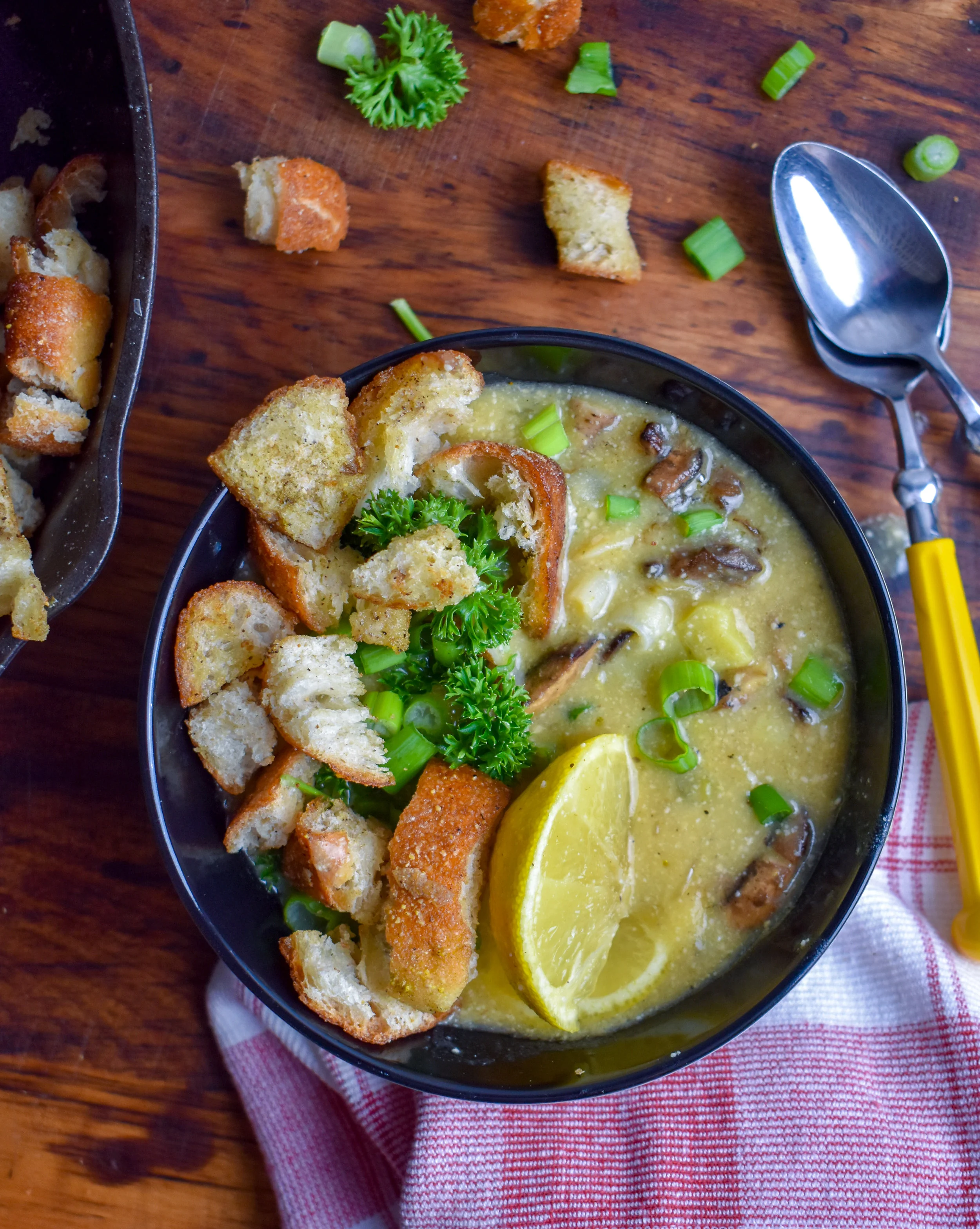 8. Finish by serving into 4 bowls with scallions and croutons. Squeeze lemon into the soup and mix well. Enjoy!