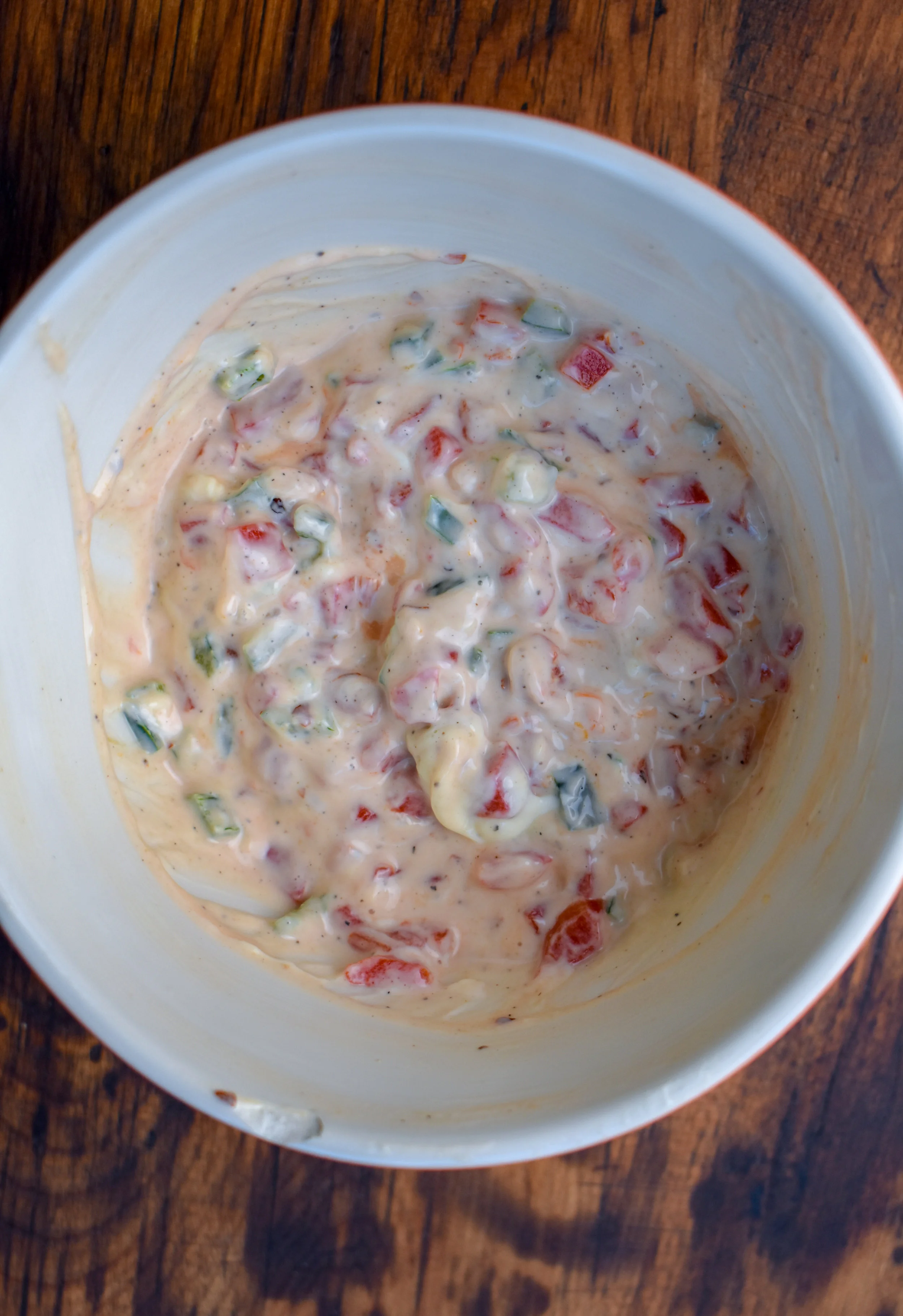 5. Right before the cheese is done, mix together the mayo, cream cheese, and all other ingredients from "The Rest" sans pretzel sticks. Set aside.