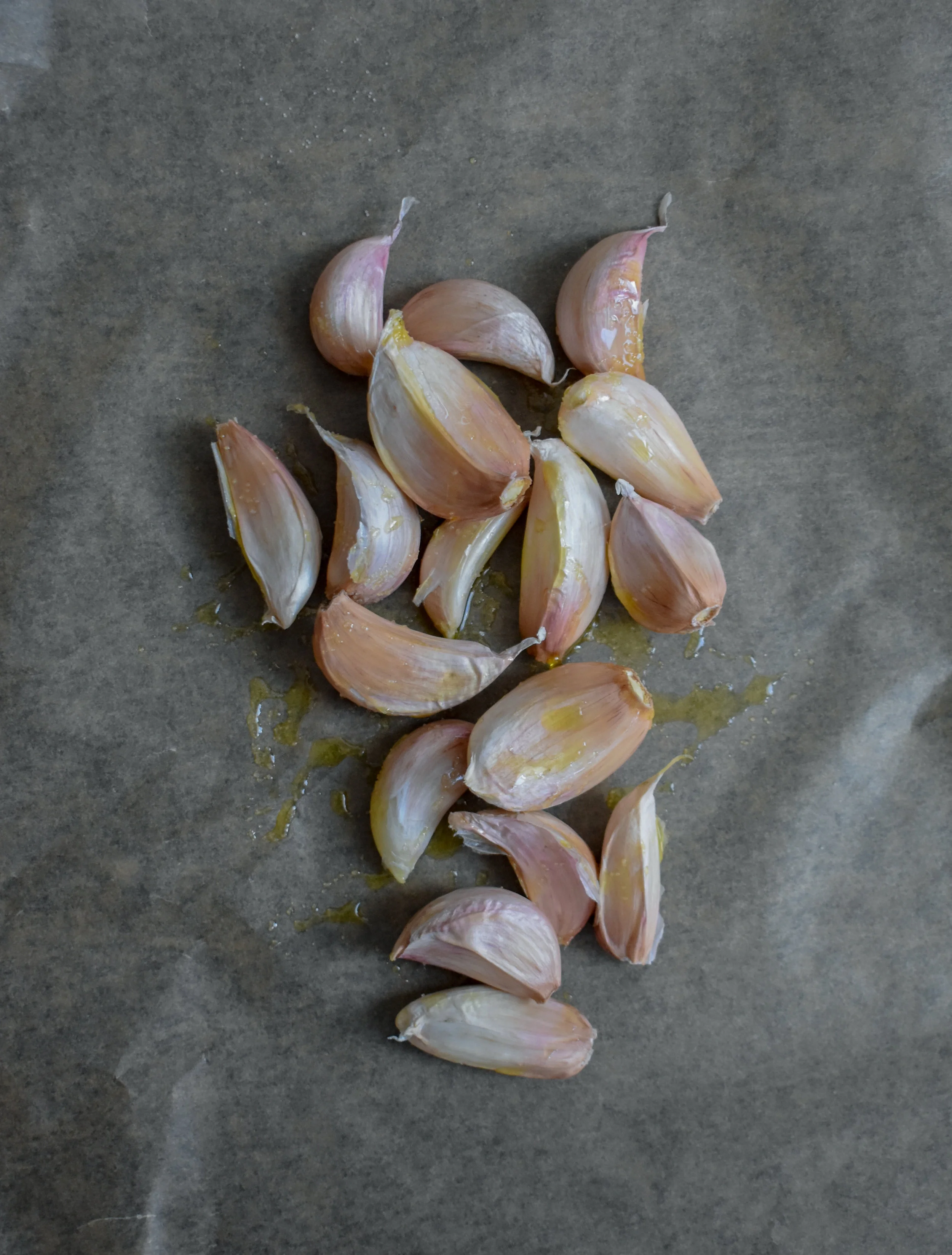 2. While the dough rises and cashews are soaking, we will begin to roast our garlic. Break all the cloves out of the head but leave the skin on. Coat with 1 tbl of olive oil and a pinch of salt + pepper. Place into oven at 375F and roast for 25-30 minutes in parchment paper or aluminum foil (enclose the cloves int either and make sure sealed tight).