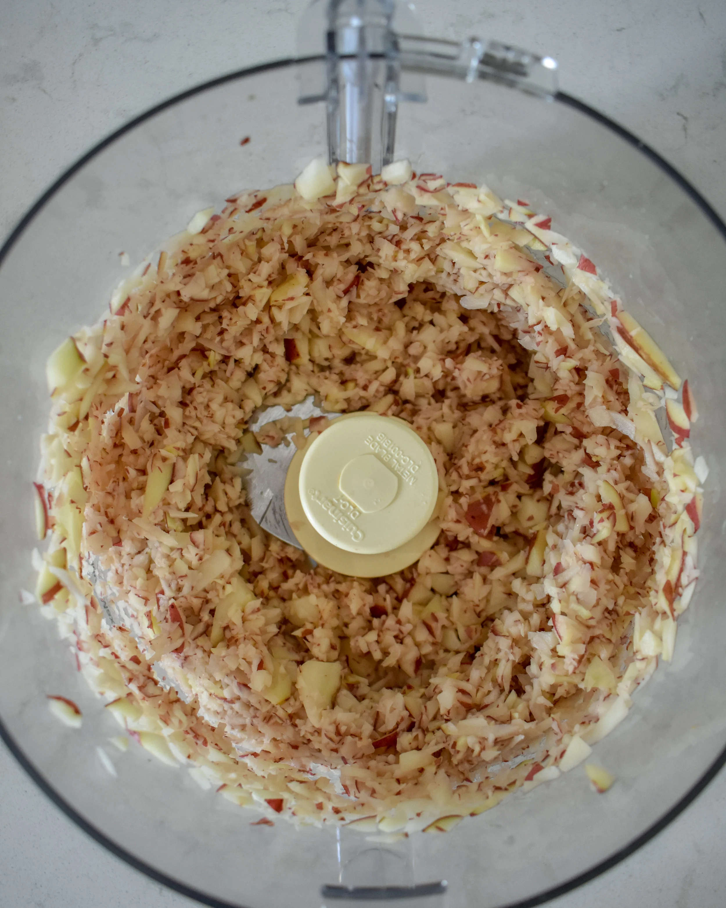 1. Place potatoes into food processor and pulse until you have shreds that are similar to hash brown consistency. Remove from processor or blender and place into a medium bowl. Cover with water and soak for 5-10 minutes.