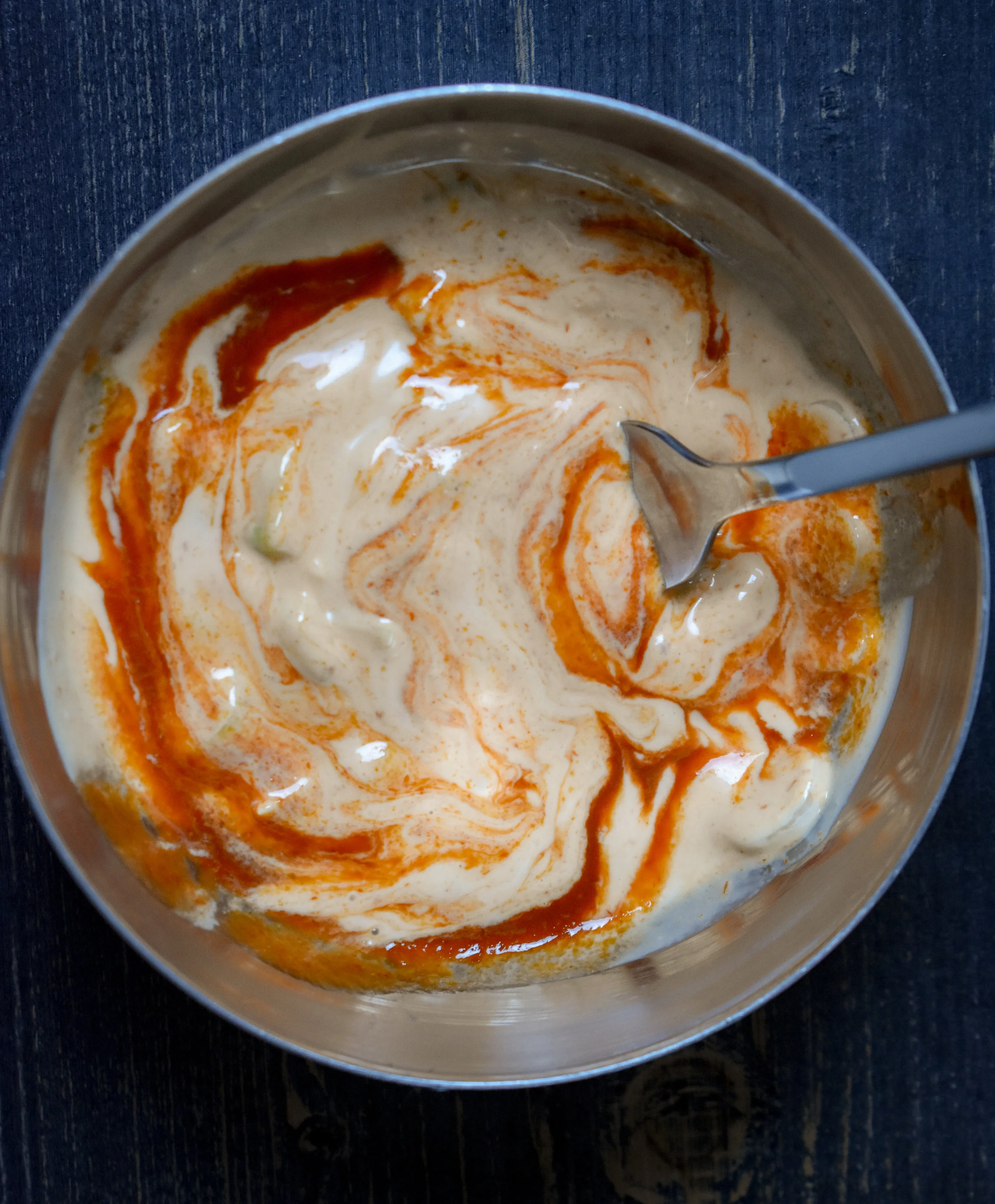 4. While the jackfruit cooks down, mix together the ingredients for the sriracha mayo.