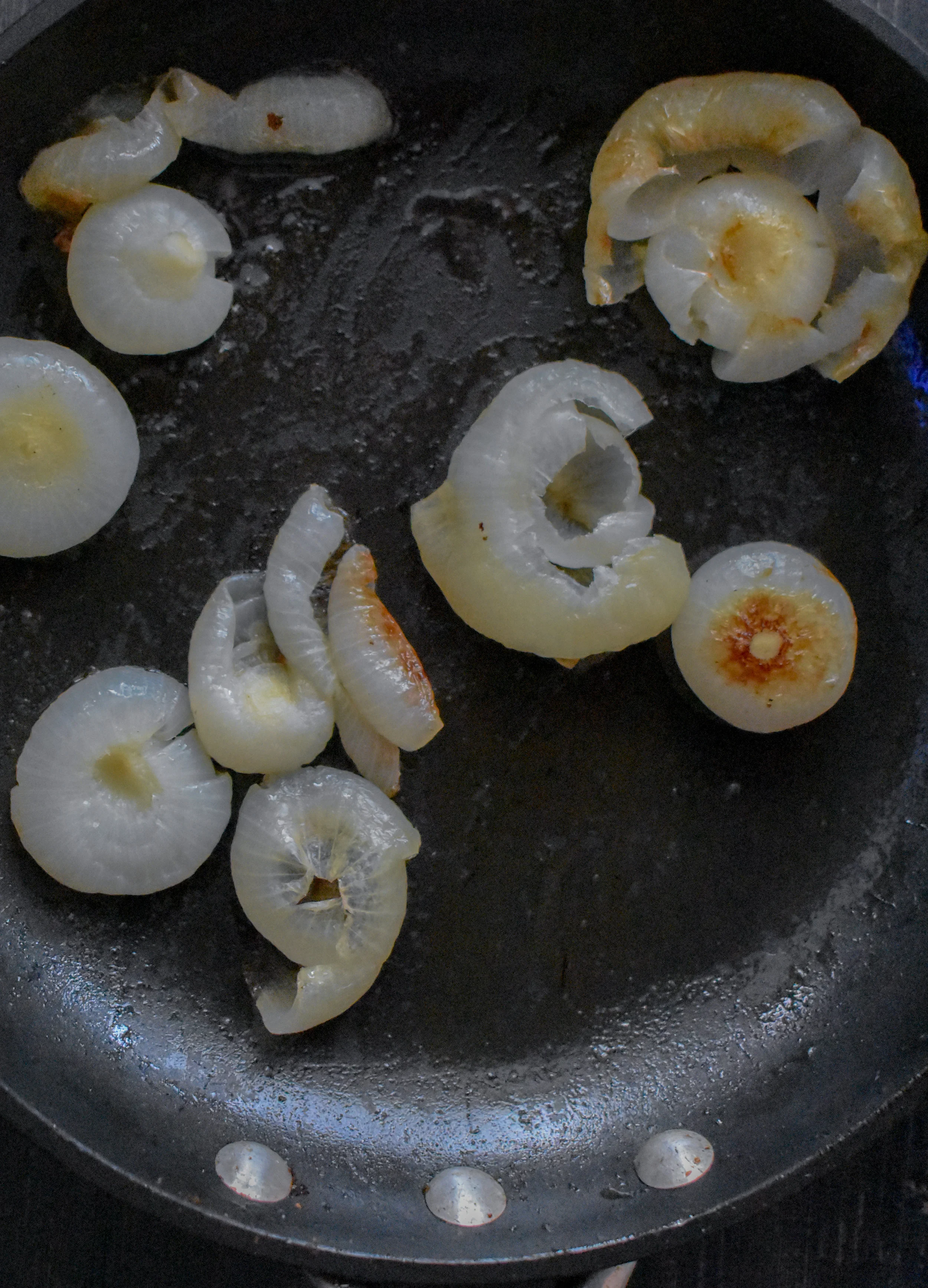 3. When onions are done boiling, add to a medium frying pan with oil and saute for 6-8 minutes over meidum heat until it starts to break down.