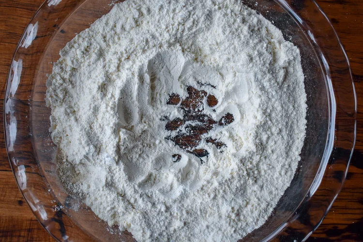 2. While waiting, mix together all the dry ingredients for biscuits and make a small well in the middle of your bowl.