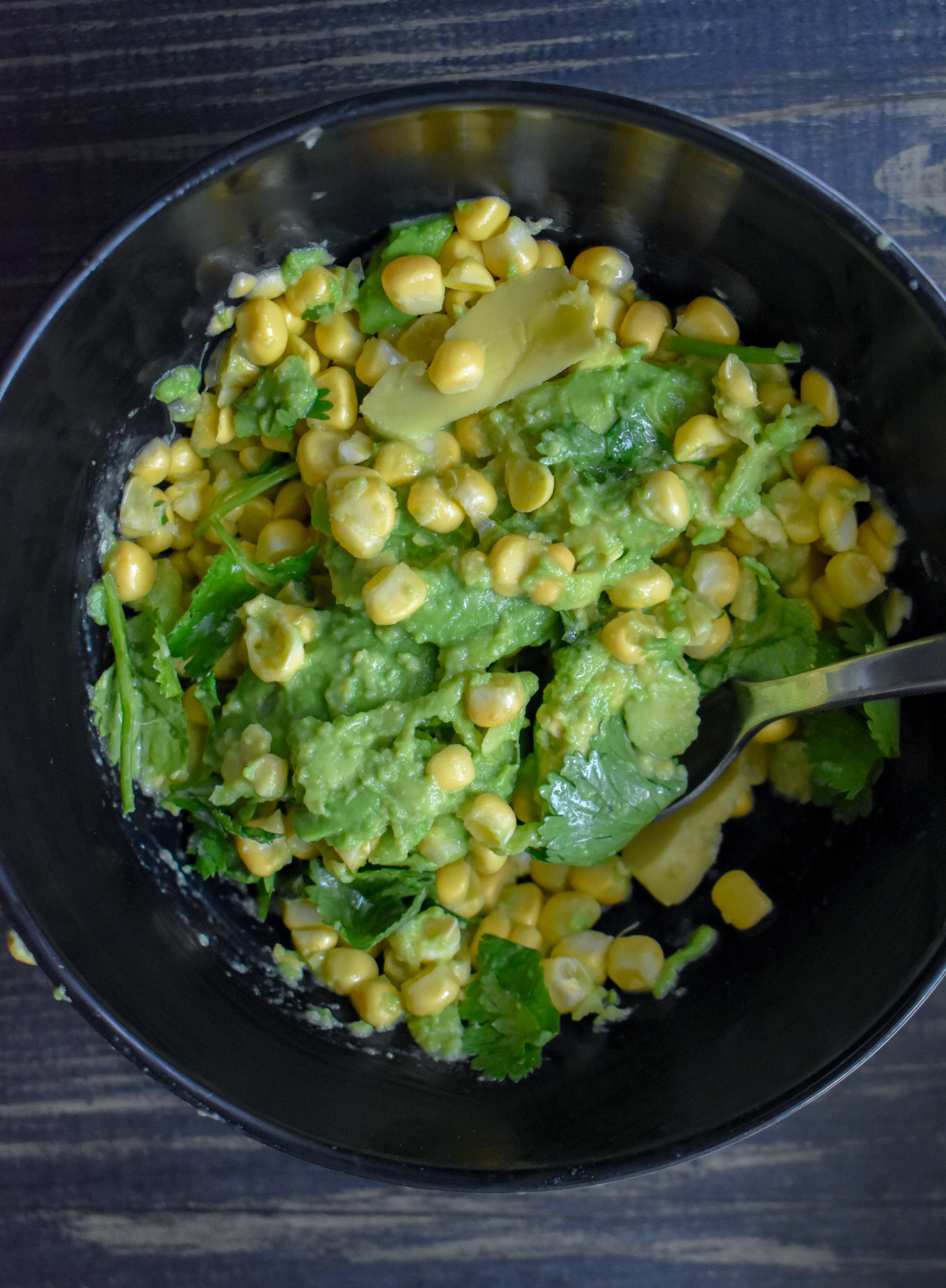 4. While the tofu cooks and you wait for the potatoes to cool, I mix up the guac quickly. Add all ingredients to a bowl, and mix with a fork/spooon. Set in fridge to serving time.