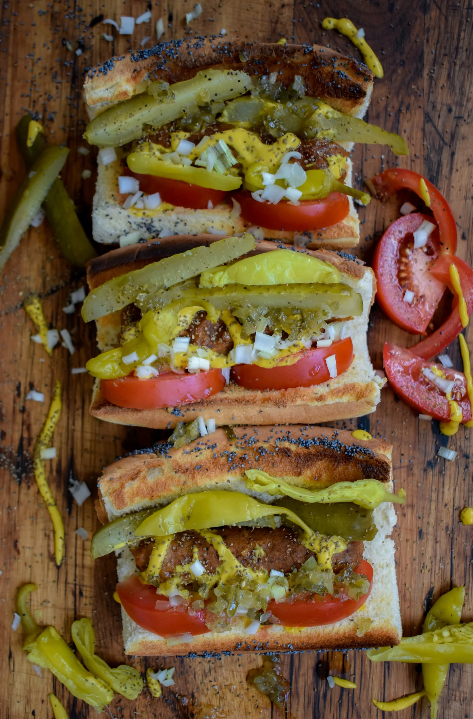 6. Next, add 1 tbl white onion, 2-3 sport peppers, 1 tbl relish, 2-3 tomato wedges, and finish with 1 tsp celery seed.