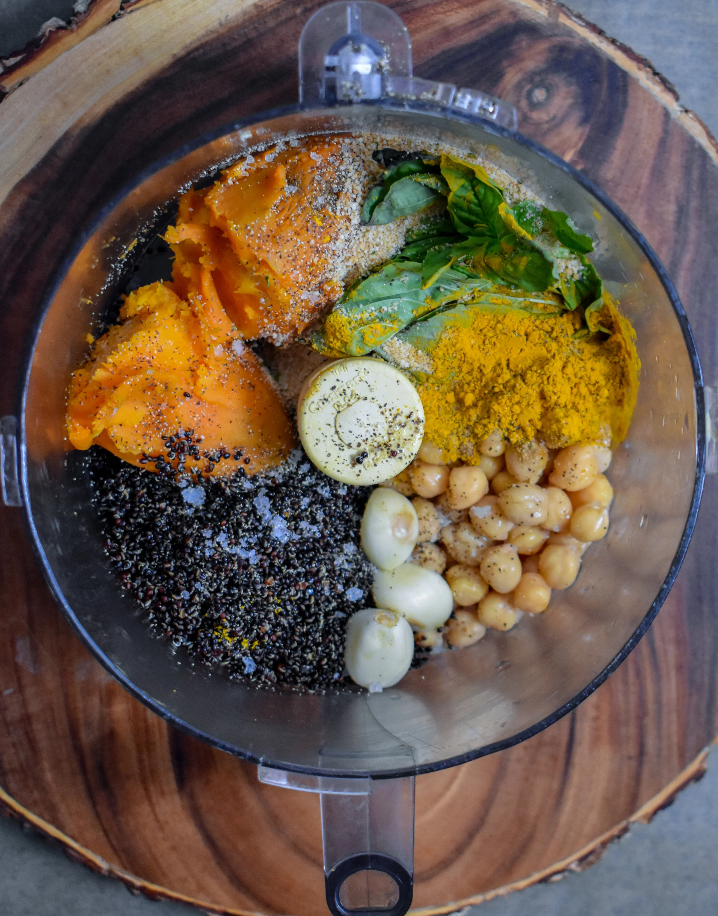 4. Once the sweet potato + quinoa are done, mix together all the ingredients for burger (including cooked onion + pepper) in a food processor (except AP flour) and pulse 8-10 times. Don’t overmix it as you want some chunks of sweet potato to still exist.