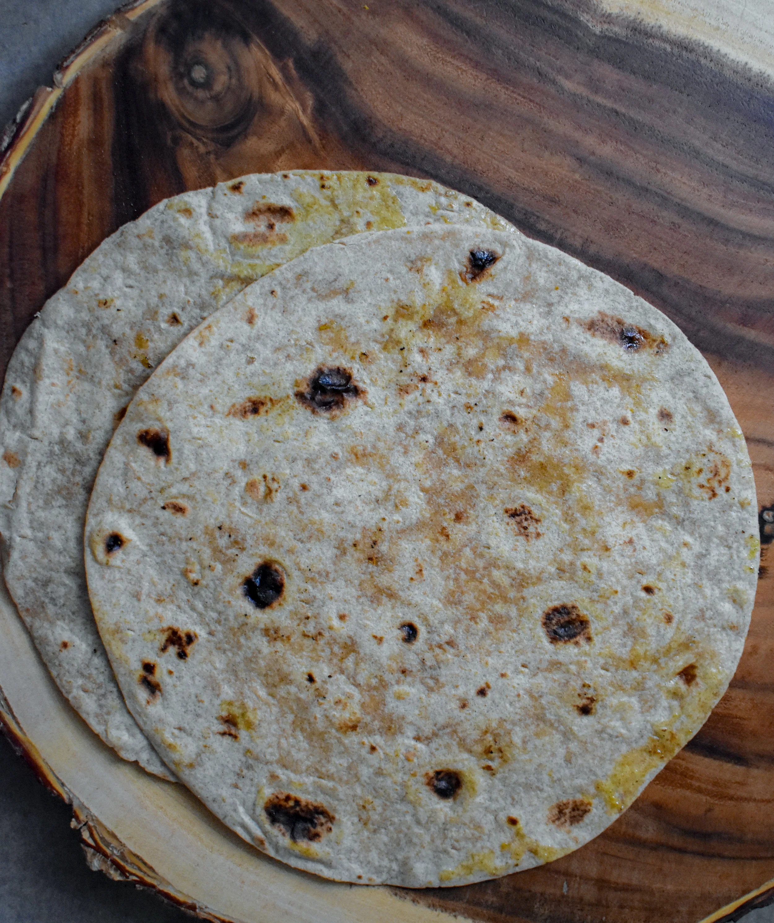 8. While patties are cooking, you can warm up several roti in a dry pan or in the microwave or broil in oven.