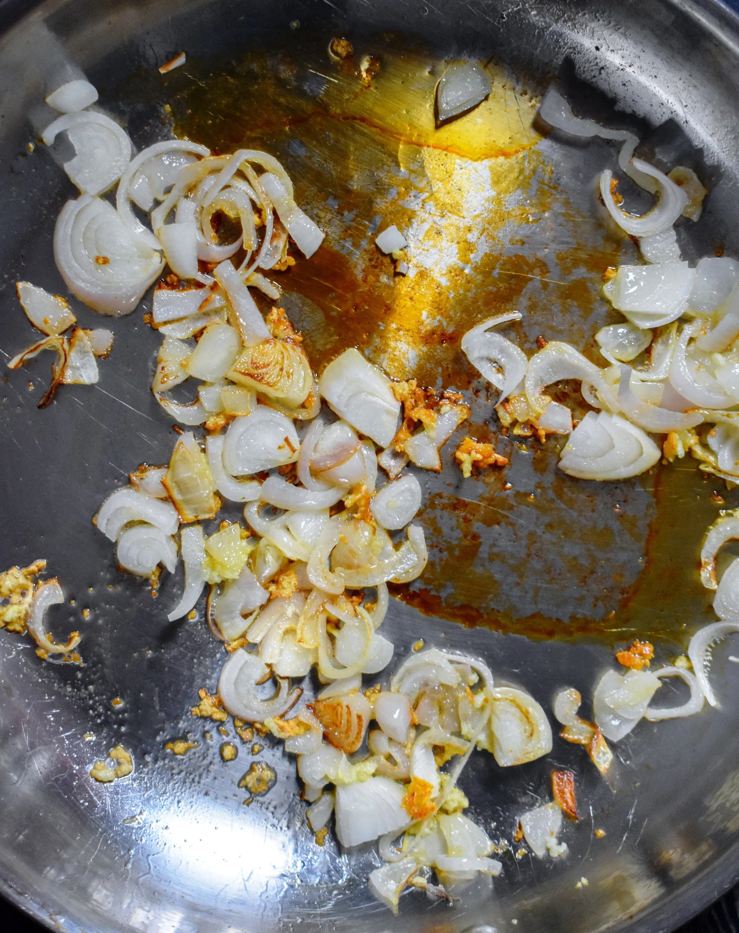 1. To start, add shallots, garlic, and oil to medium pan and cook over medium heat for 5-6 minutes.