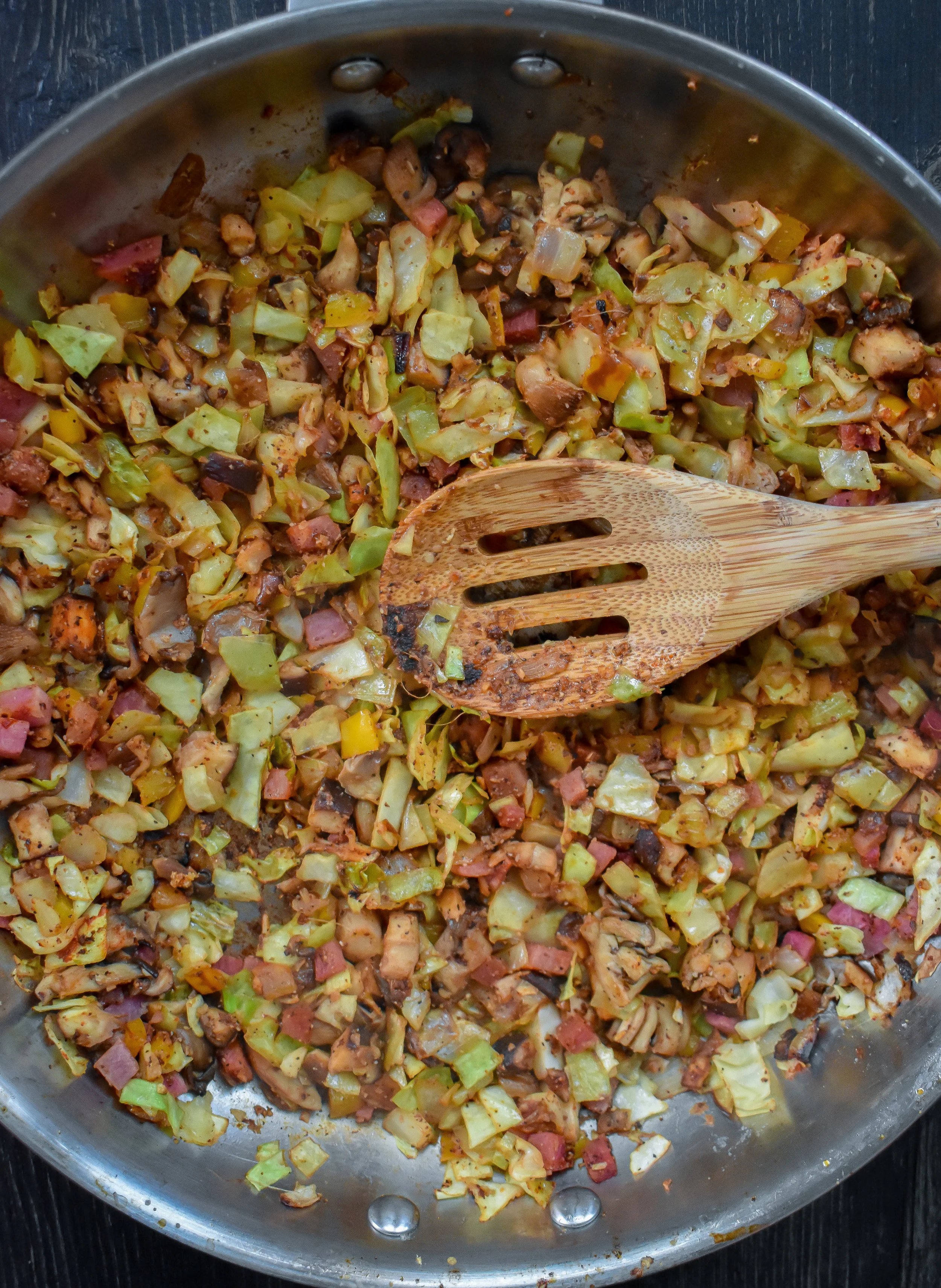 2. Next, add the cabbage and radish. Add 1-2 tbl of water to soften things up. Cook for 6-7 minutes. Set aside. Let it cool for 5-6 minutes.