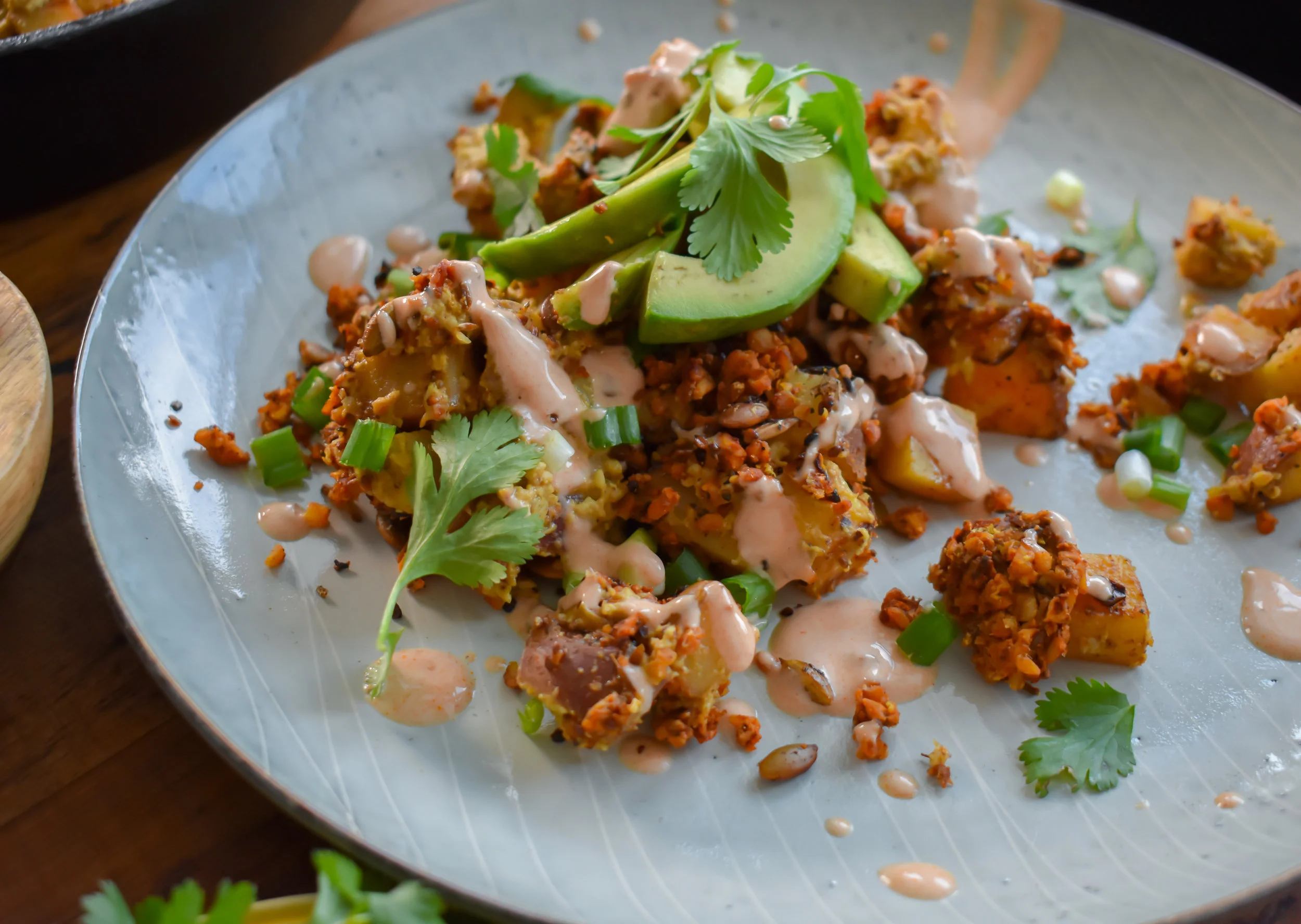 Loaded Breakfast Potatoes w/ Tempeh Chorizo, Pistachio Queso and Toasted Pepita Crunch