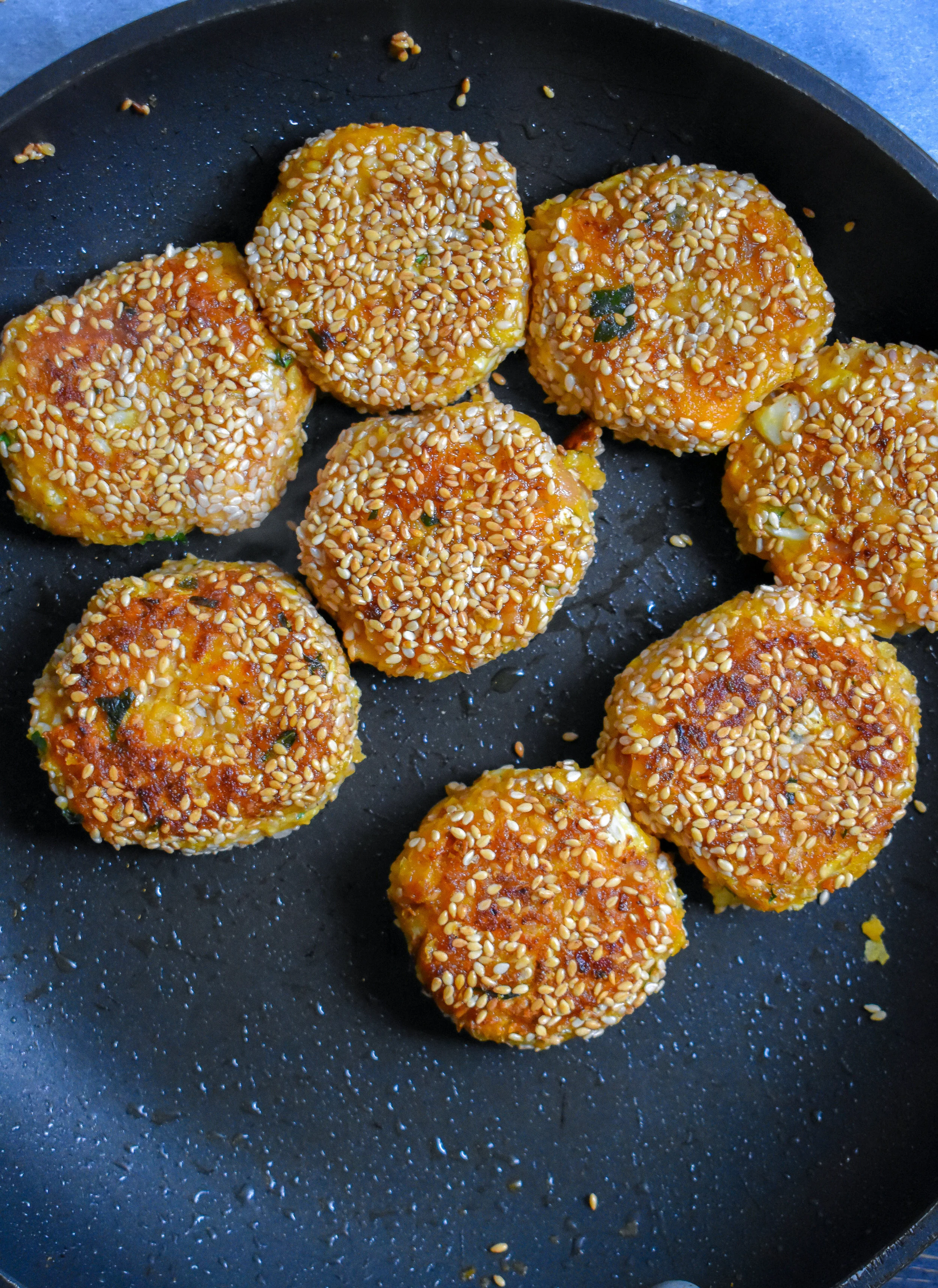 5. Add 7-8 falafel patties to a medium to large frying pan and cook over medium-high heat for 4-5 minutes until browned and crispy on each side.