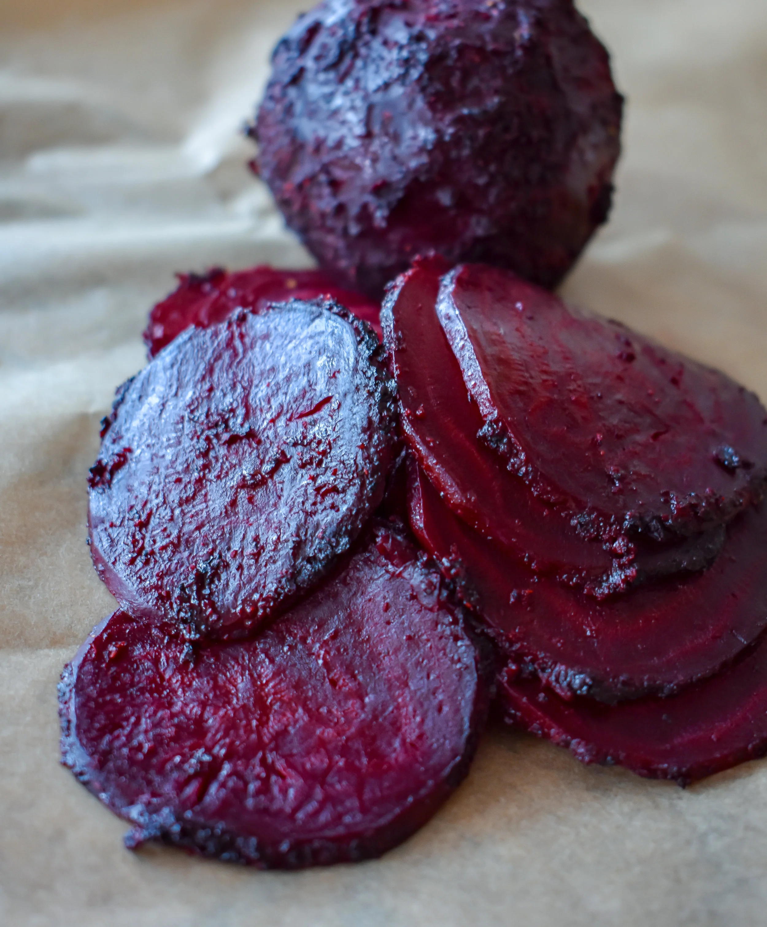 9. Using a mandolin or sharp knife, slice the beets to a 1/8 - 1/4 inch thick. This will create a very thin soft almost meat like beet round.