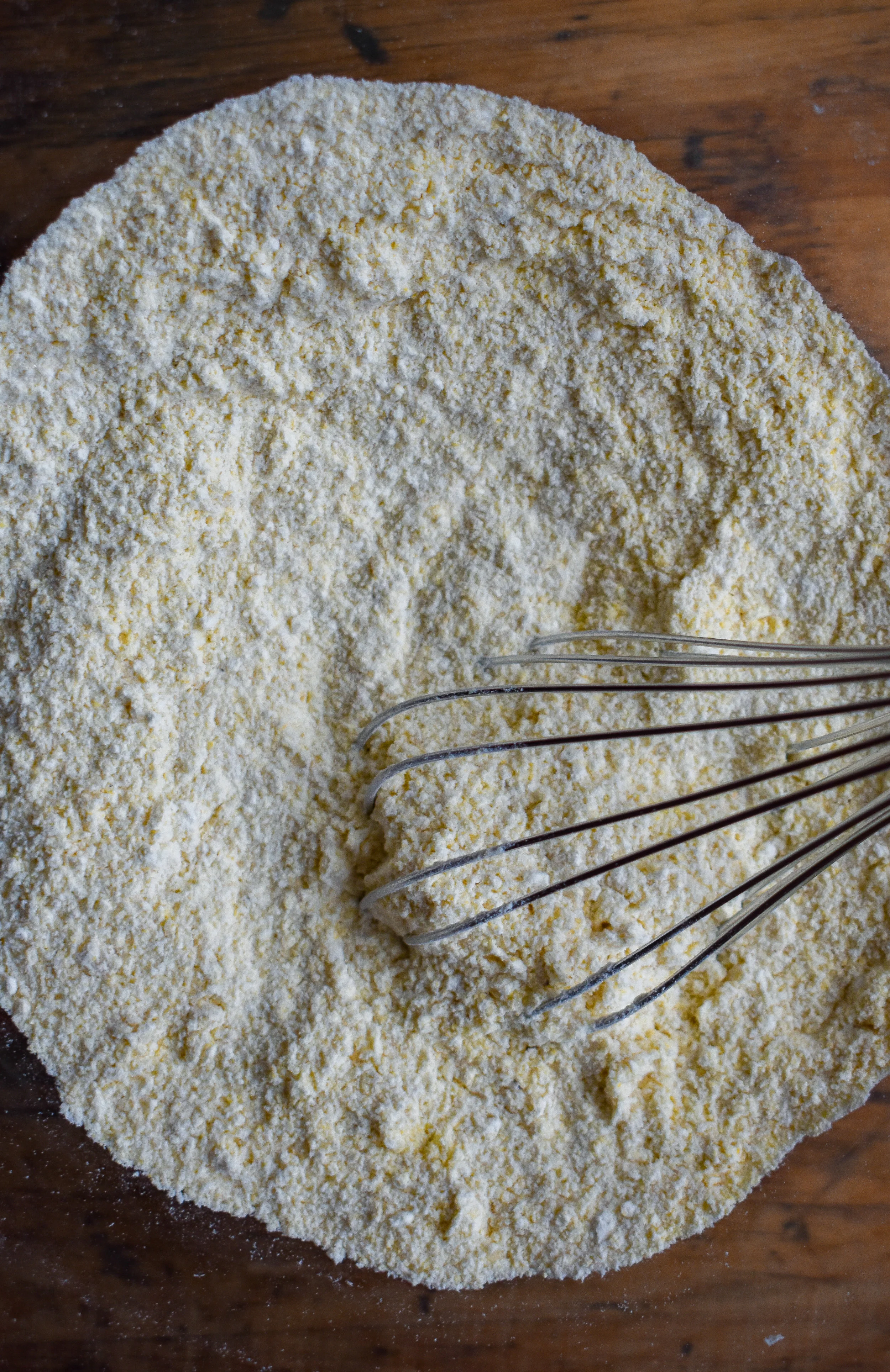3. One hour before the slowcooking is done (or anytime before … if you start earlier the cornbread won’t be warm) mix together the dry ingredients for the cornbread - flour, cornmeal, baking powder, salt, and sugar.