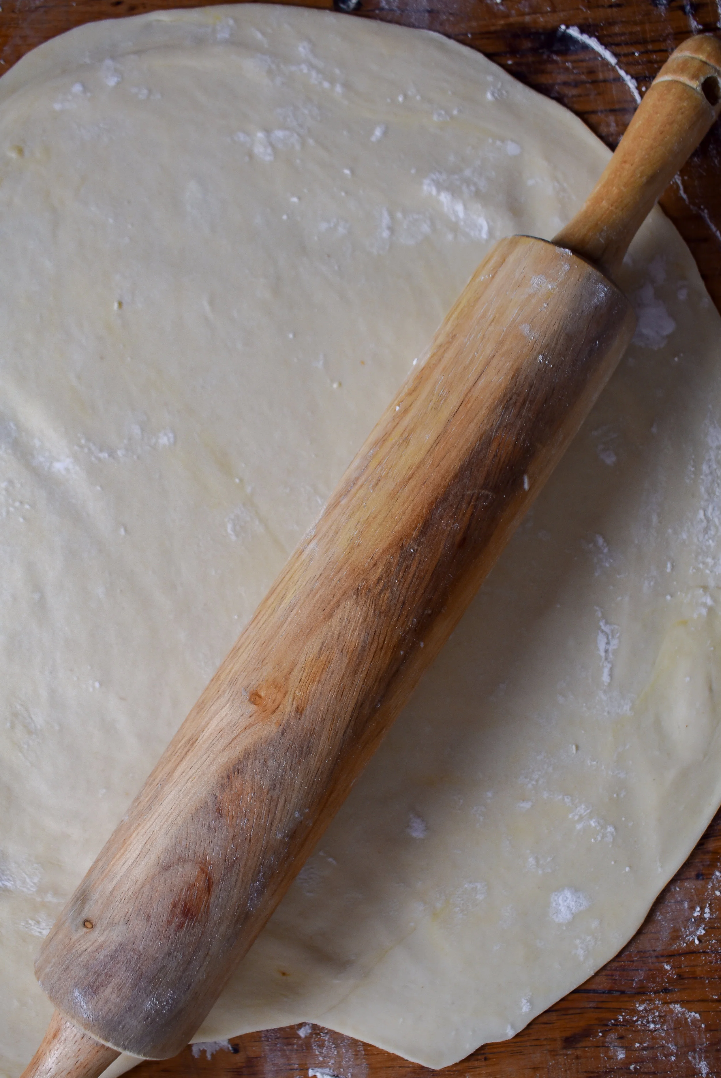 7. After the potatoes + leeks are done, divide the dough into 2 parts and roll out till about 14 inches by 14 inches.