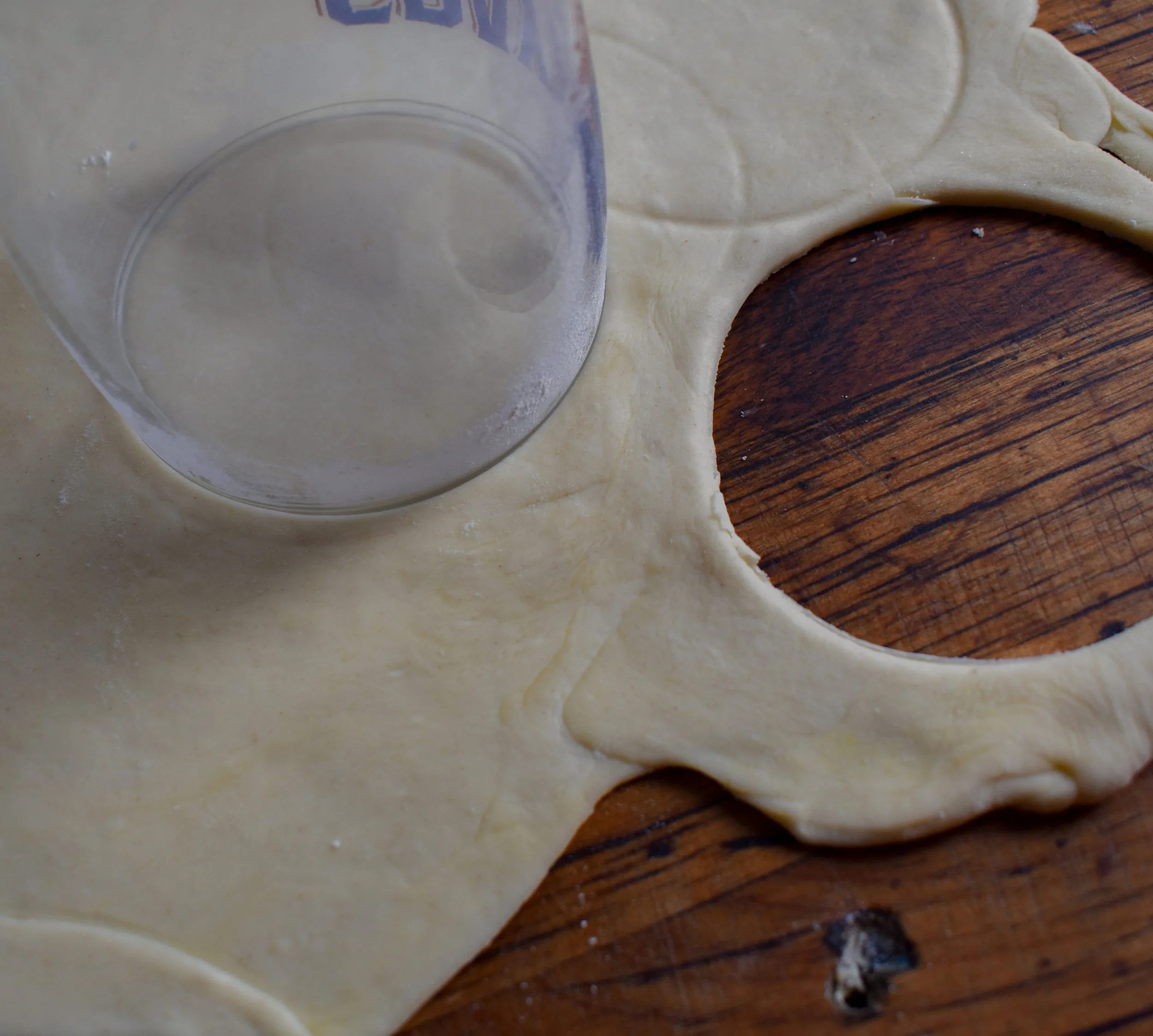 8. Using a glass with a 3 inch diameter, cut out dough rounds.