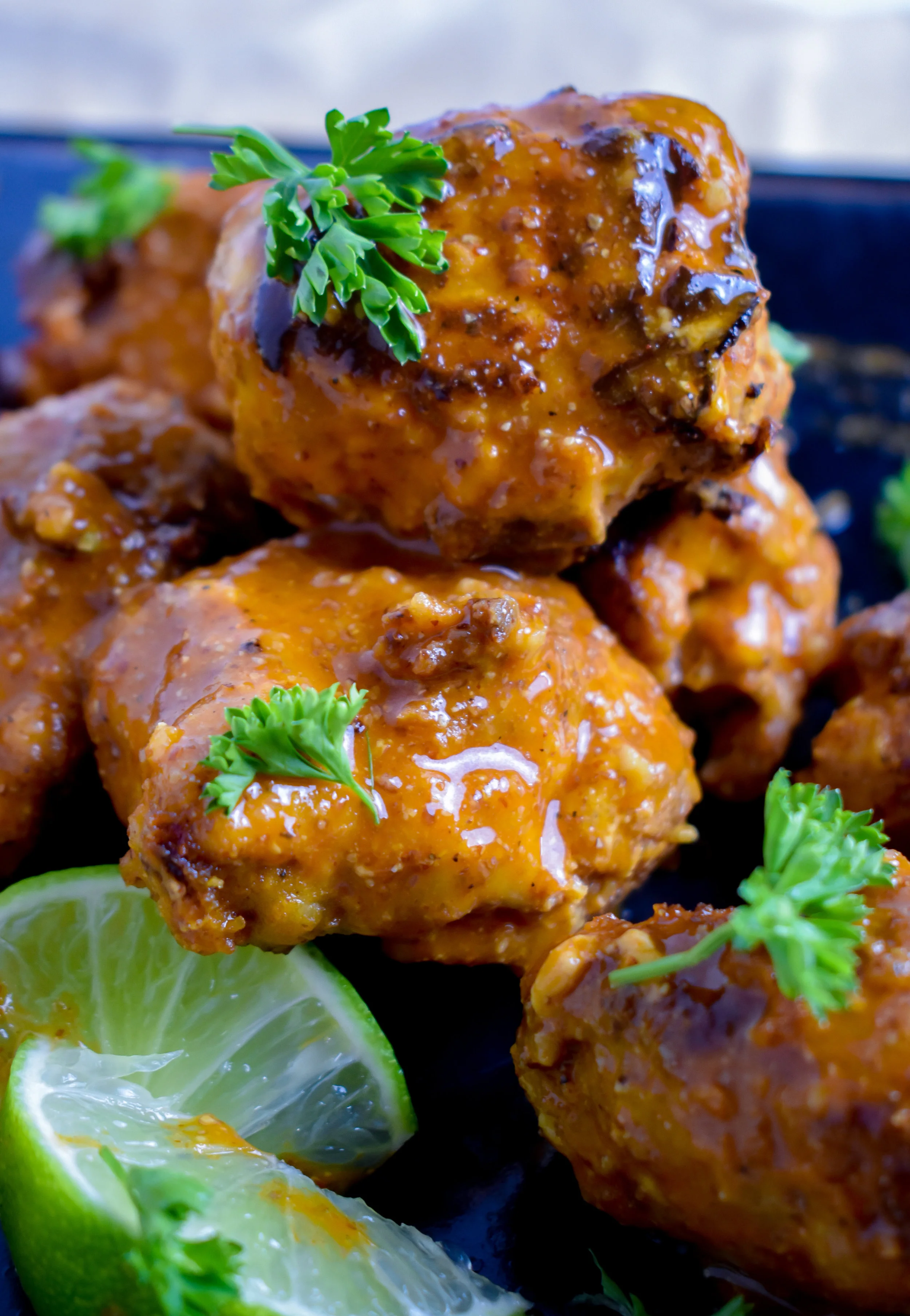 7. To serve, brush on the buffalo sauce on all wings until gone. Serve warm!
