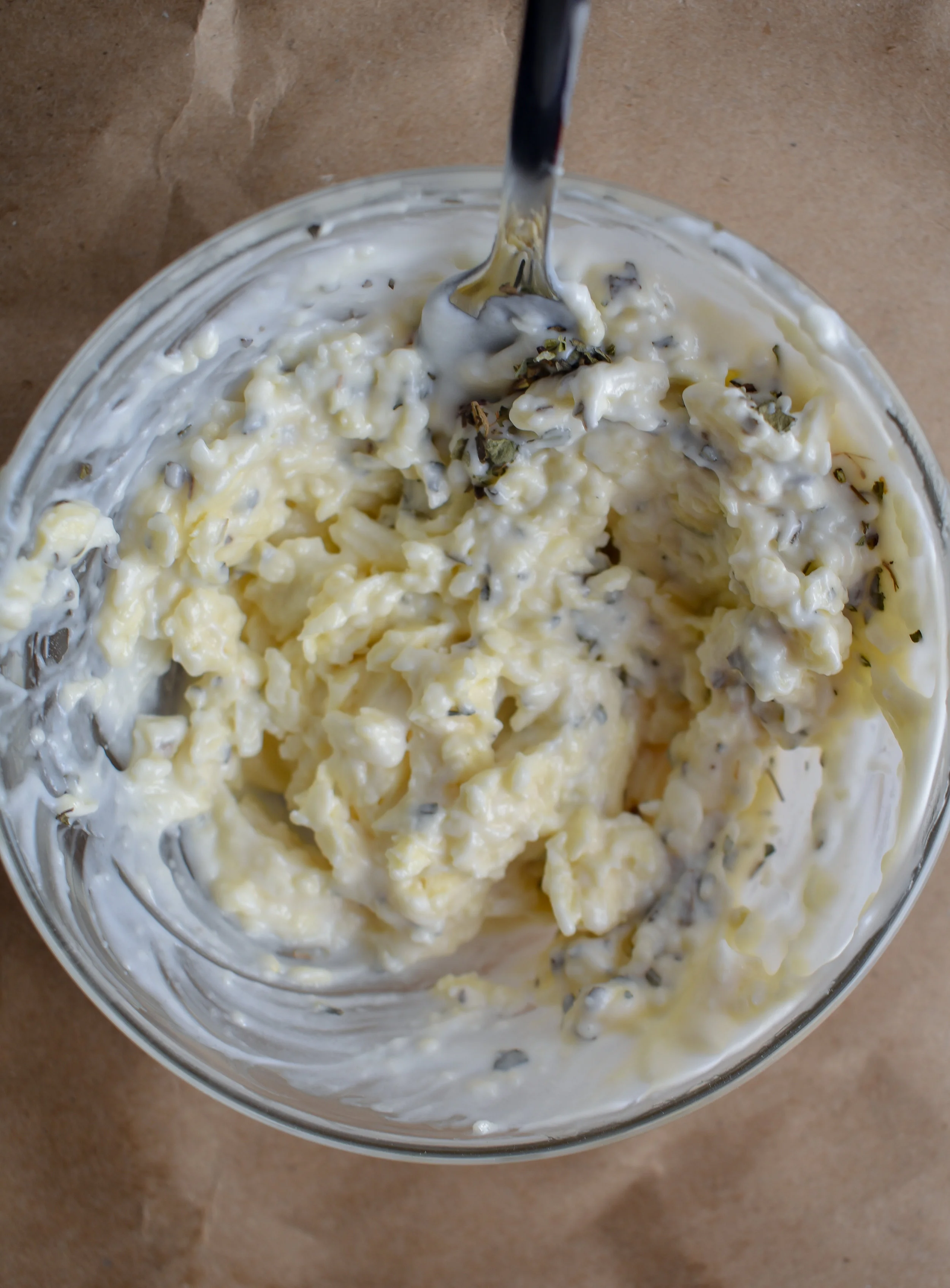 4. While the tomatoes roast, we will prep the rest of the ingredients. Start by mixing together the butter mixture for the grilled cheese. Mix with a fork to better combine. Set aside.