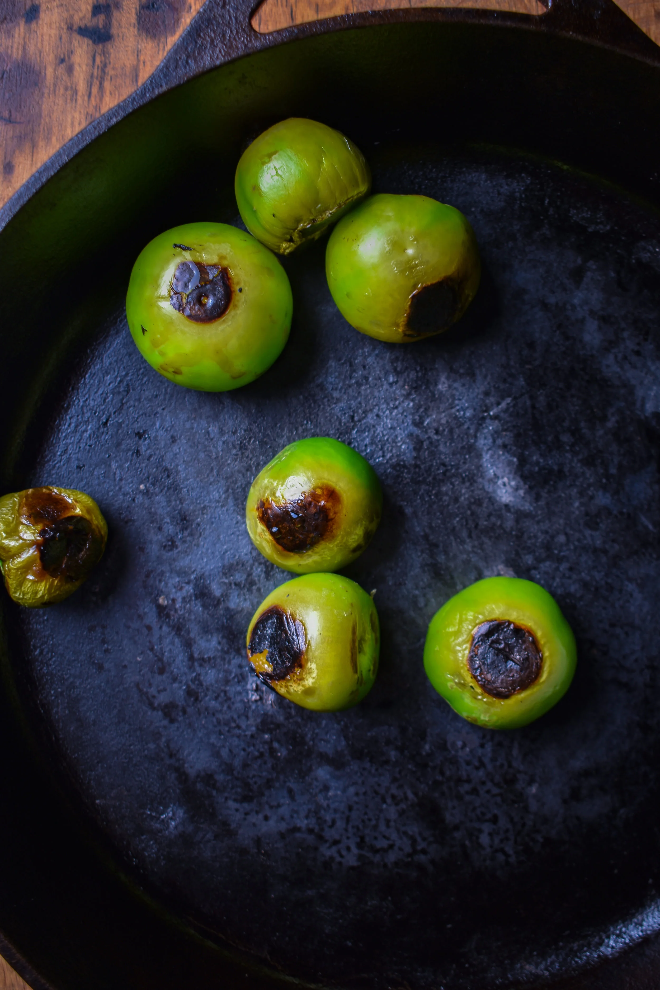 5. Once the potatoes are done, wipe the pan out and then add to medium-high heat dry (no oil). After 2 mintues, add tomatillos and cook until charred. Usually about 2-3 minutes and rotate. I do it for about 8-10 minutes until most sides are charred.