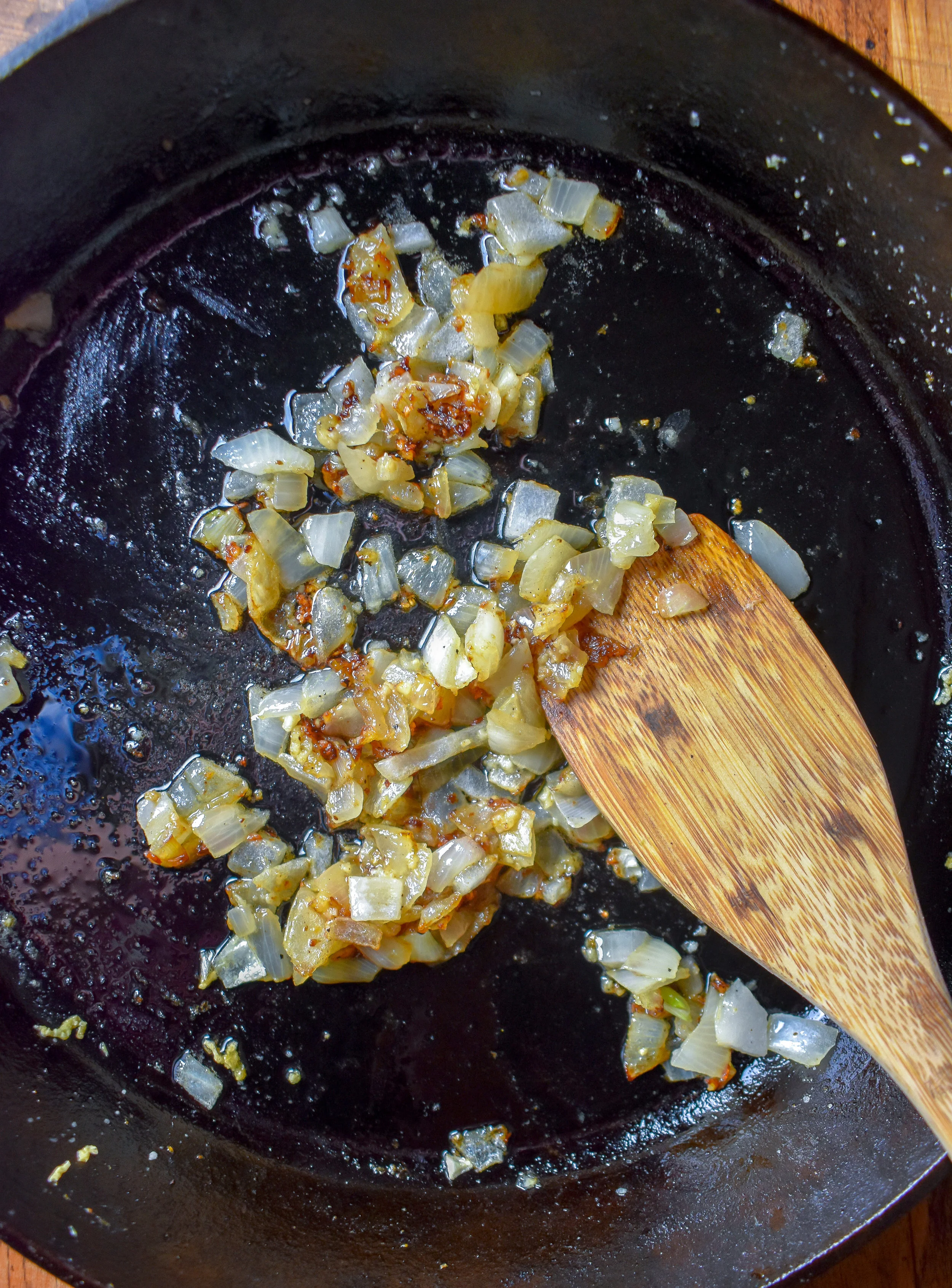 1. To start, place vegan butter, yellow onion, and garlic in a large pan. Cook over medium heat for 5-6 minutes.