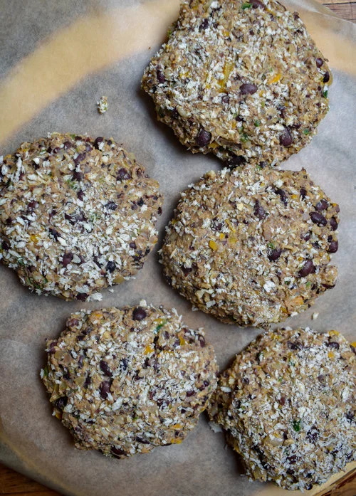 3. After the rice is done cooking, add the pecans to food processor for burger patty. Pulse 8-10 times. Add rest of ingredients for burger and process until well mixed. Form into 4-5 patties. I did 4 large ones. Set aside.