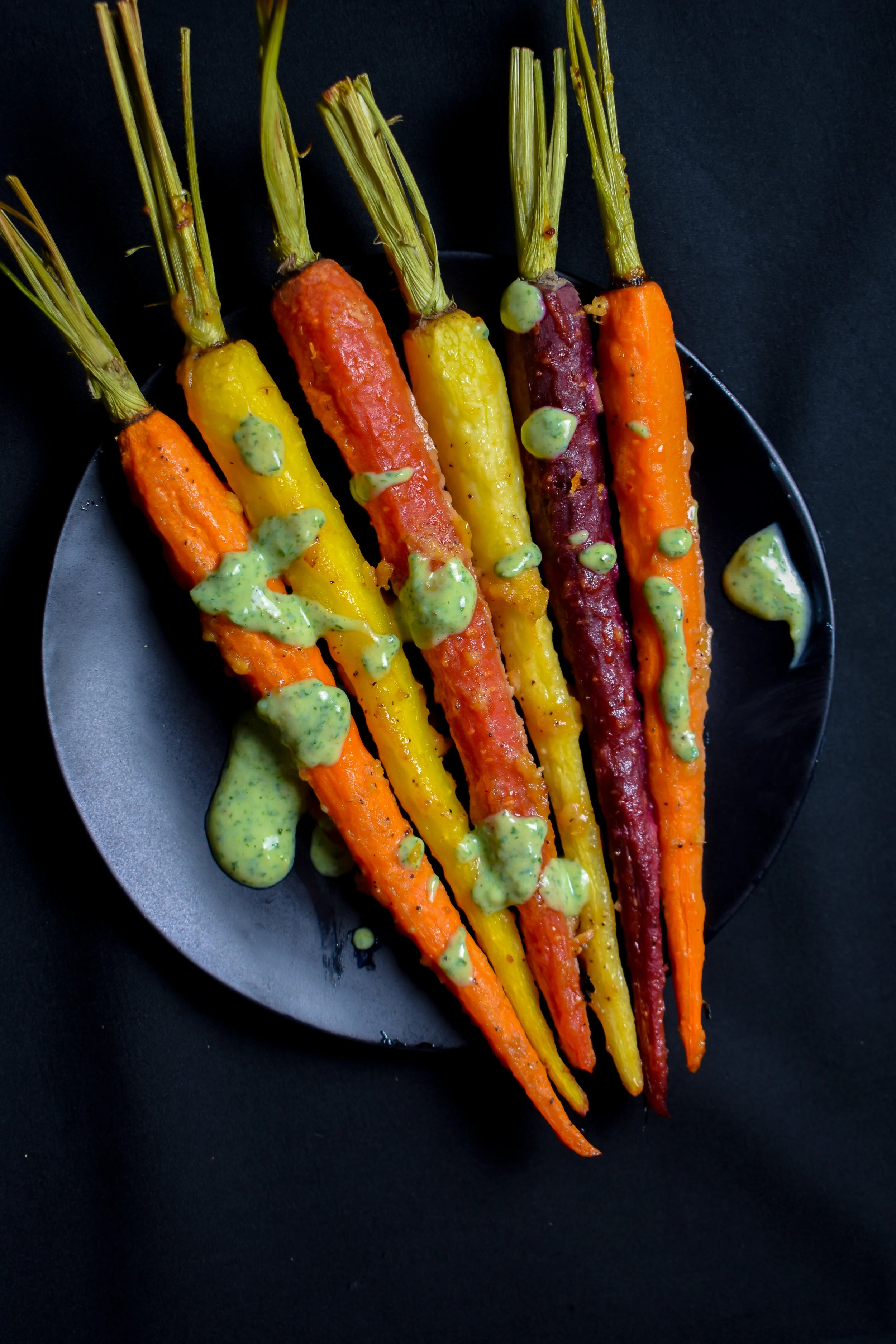 4. To finish, add the carrots to your plate, drench in crema. Enjoy homies!