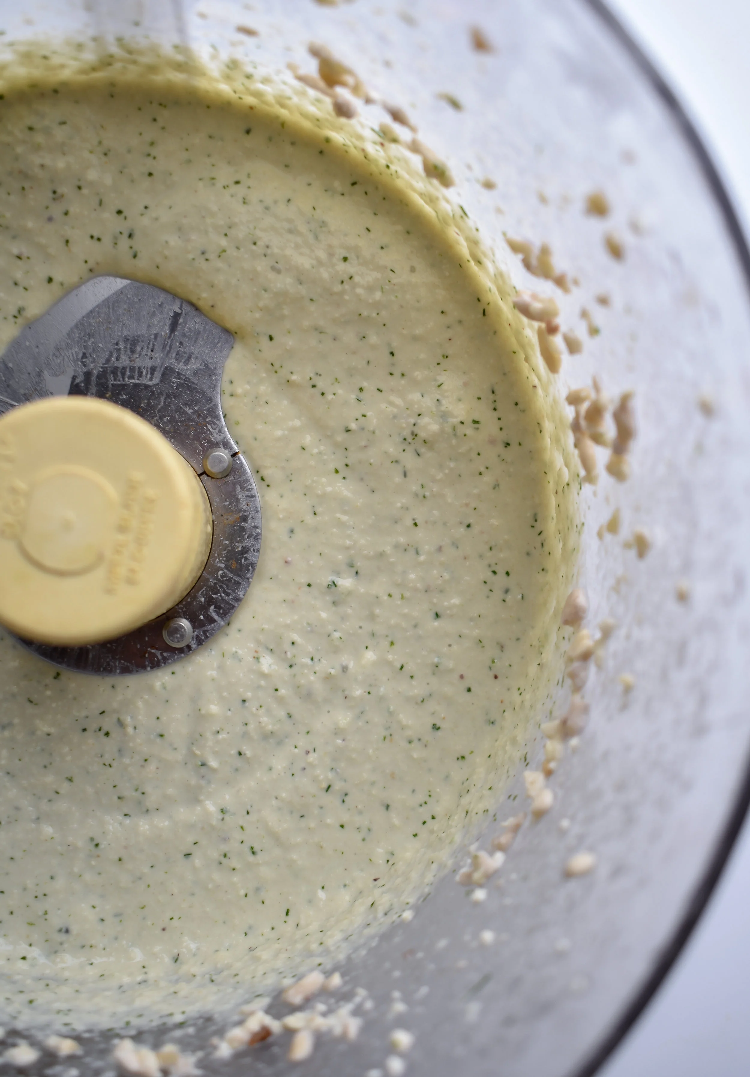 4. Once the cashews have boiled and sat for a while in the water, add to a food processor with the rest of the ingredients sans 1 tbl dill. Run in the food processor for 20-30 seconds. Turn off scrape down and rerun for 20-30 seconds. Add the fresh dill into the creme fraiche!