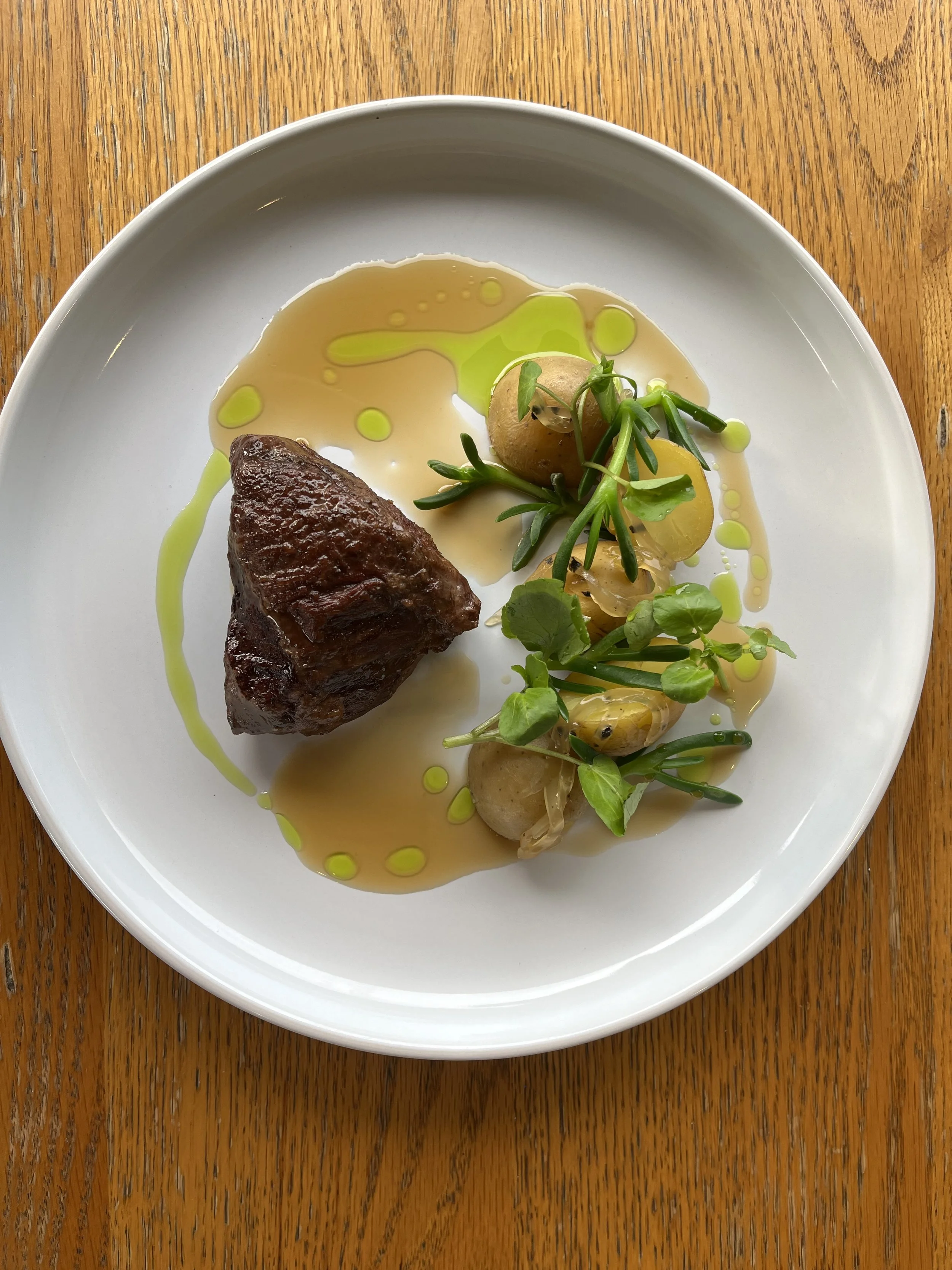 KOMBU BRAISED BEEF CHEEK, HANGI POTATOES, ROAST POTATO AND BLACK TRUFFLE JELLLY, COASTAL GREENS AND A SEAWEED JUS