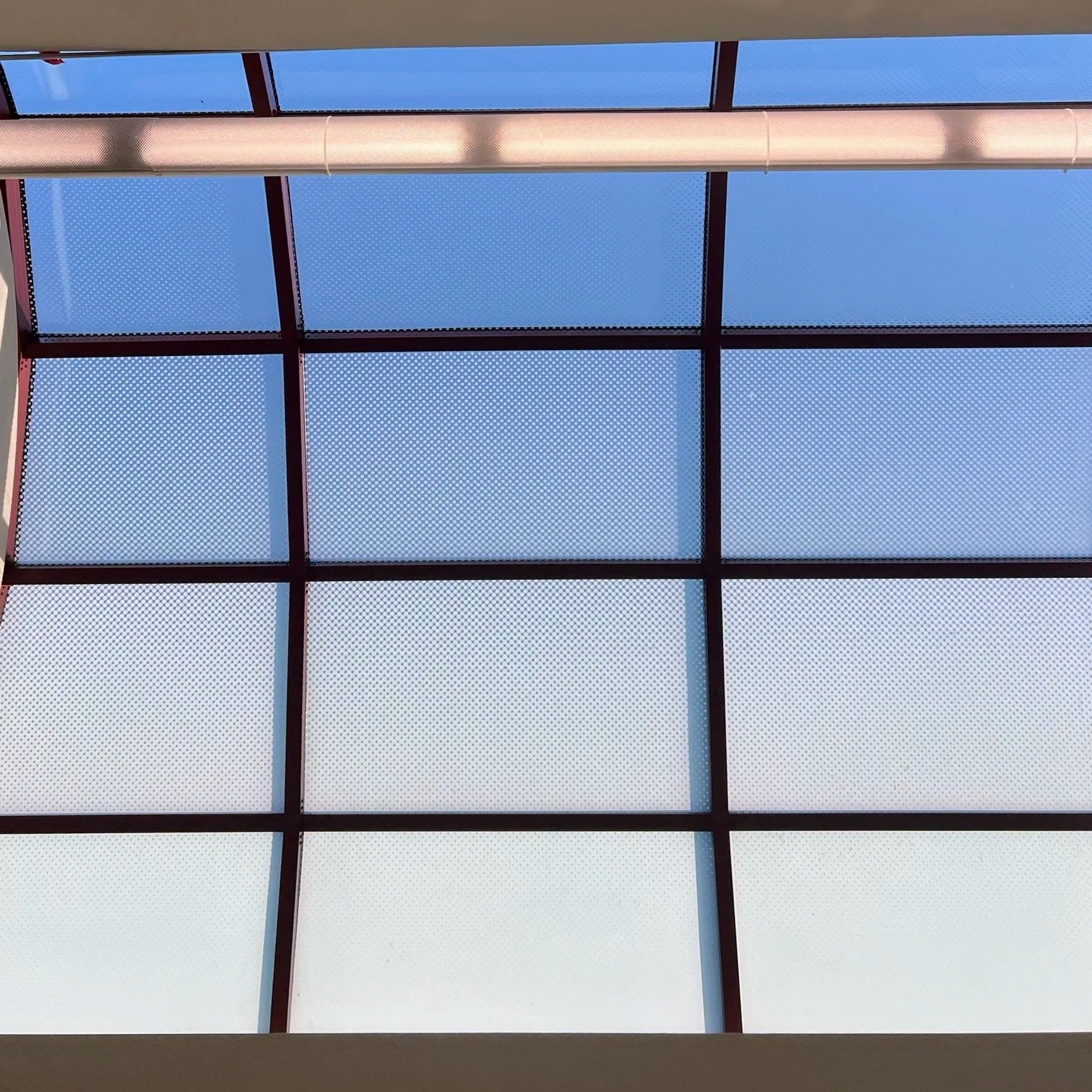 View of a skylight with gradually more transparent panels for optimal heat and light filtering.