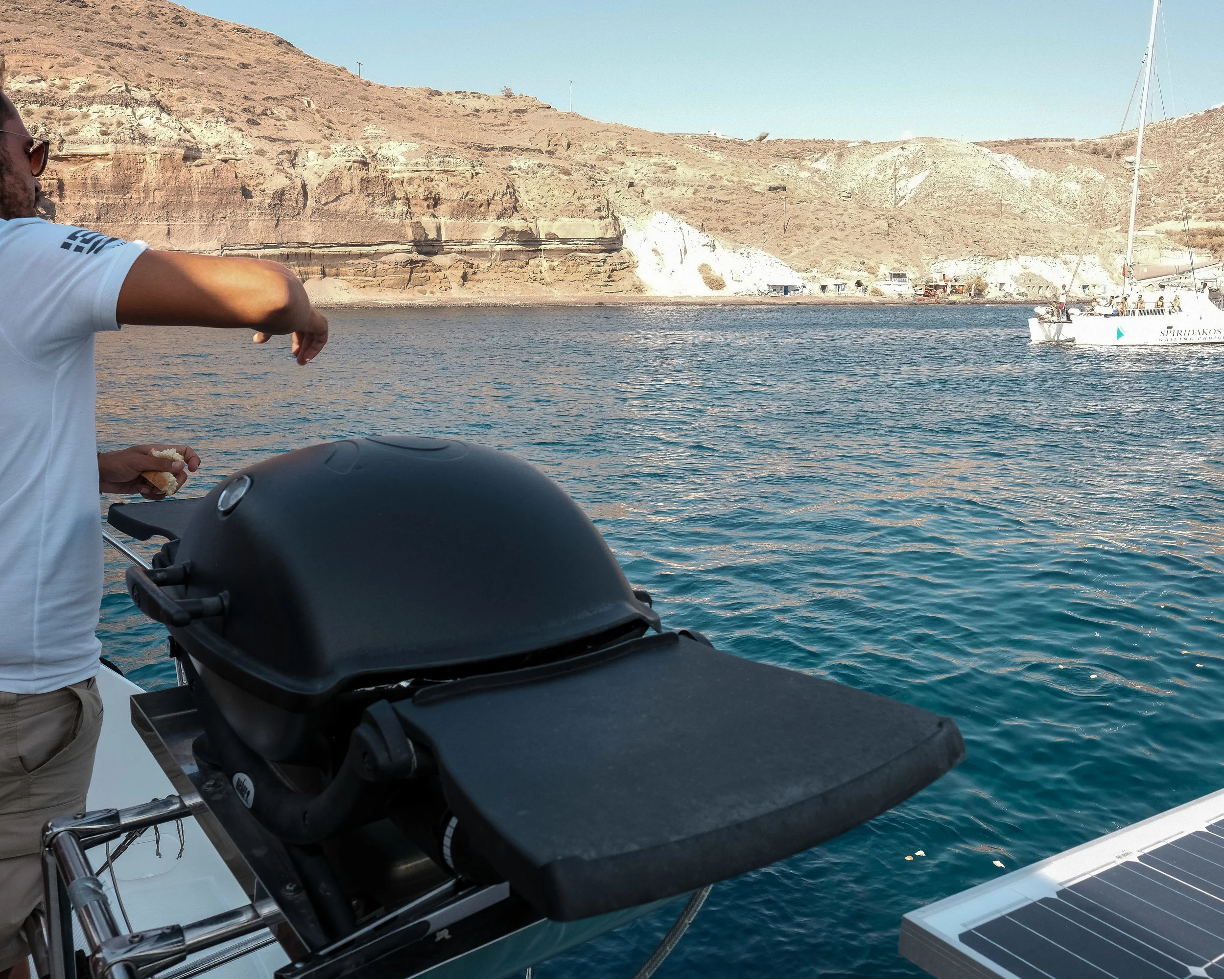 The crew throwing some bread crumbs into the water