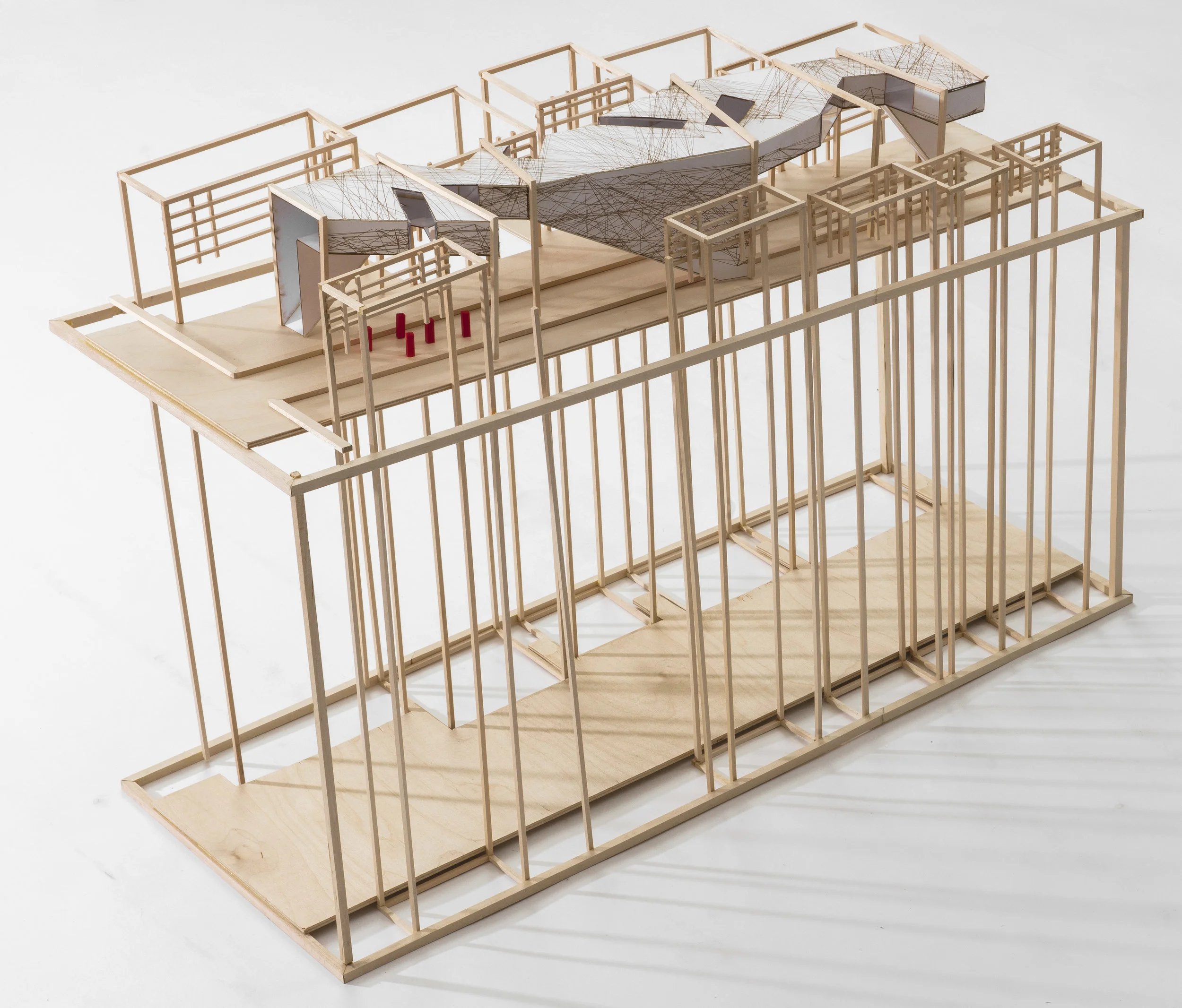 site model, with neighborhood homes acting as the framing for the intervention to exist between the building's windows