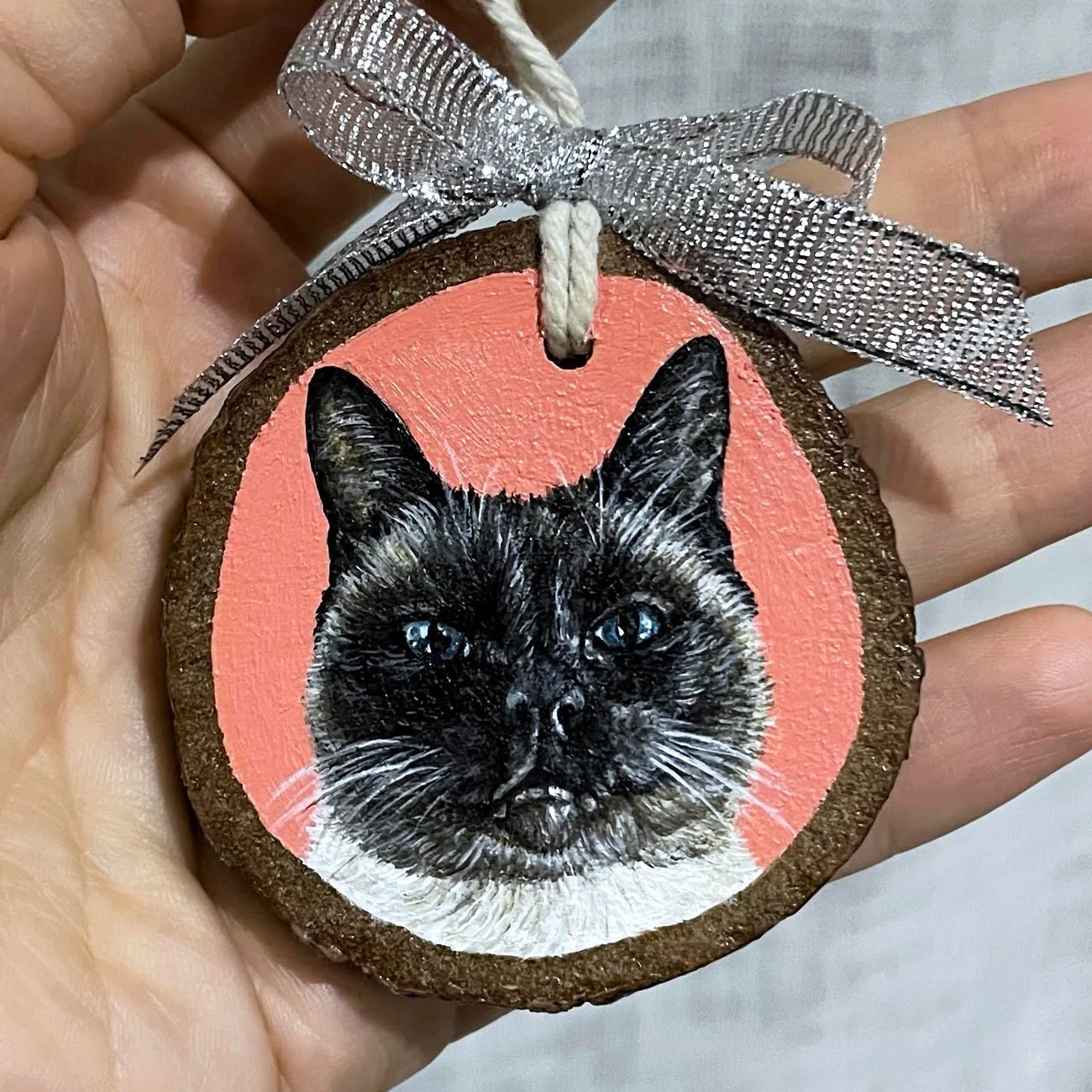 Custom acrylic cat portrait of a black and tan cat on wood ornament by Emma Sage Fine Art, Los Angeles.