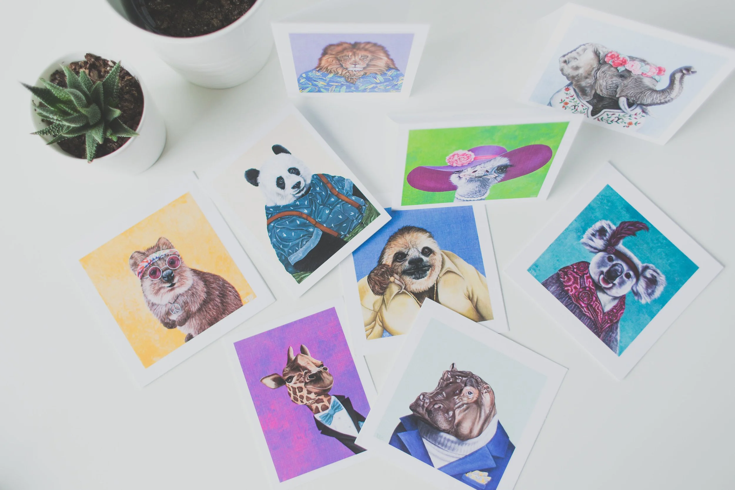 Product photo of Emma Sage Fine Art's original party animal acrylic paintings printed on greeting cards.