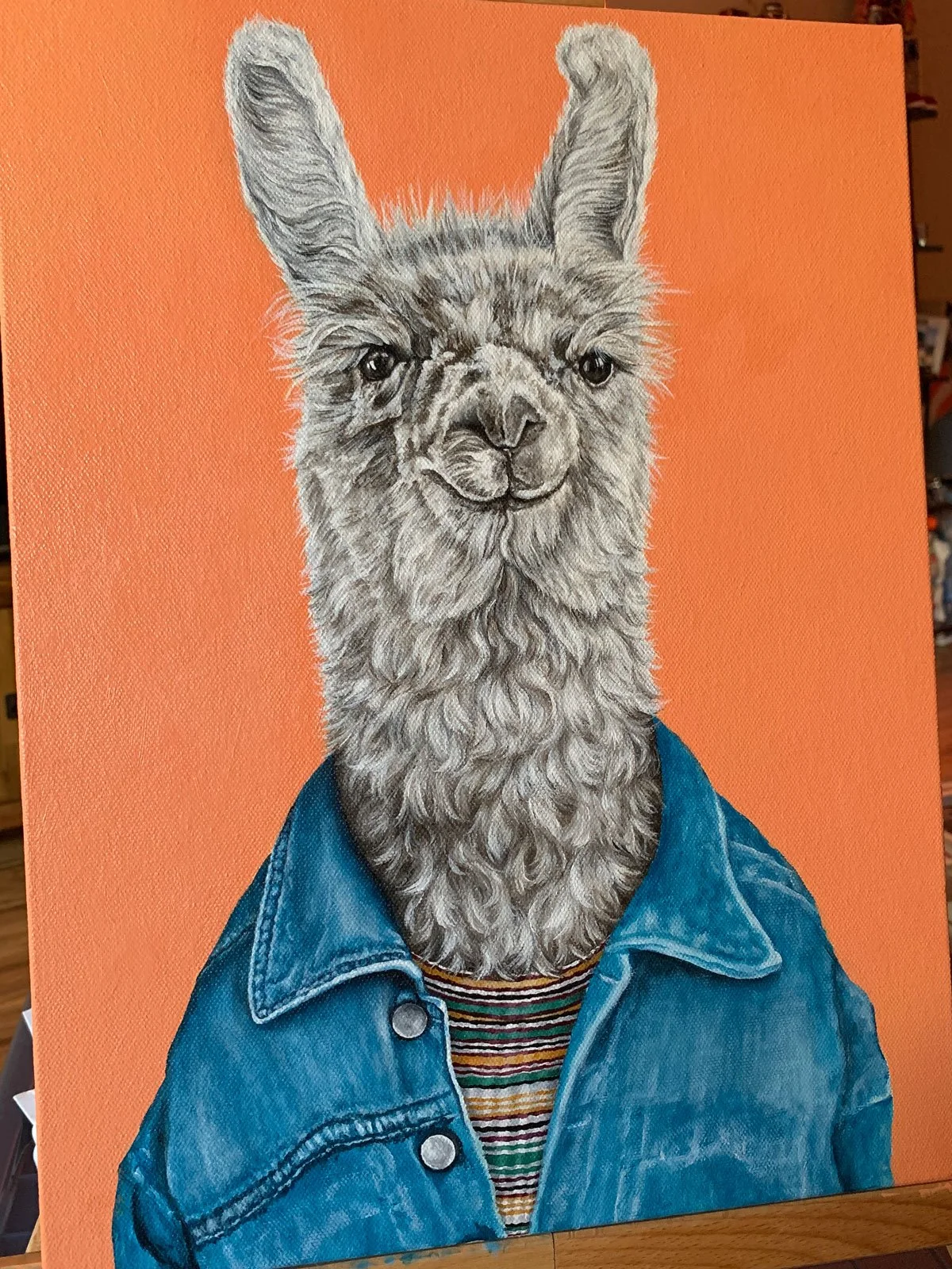 Finishing touches on acrylic painter Emma Sage Fine Art's painting, Party Llama.