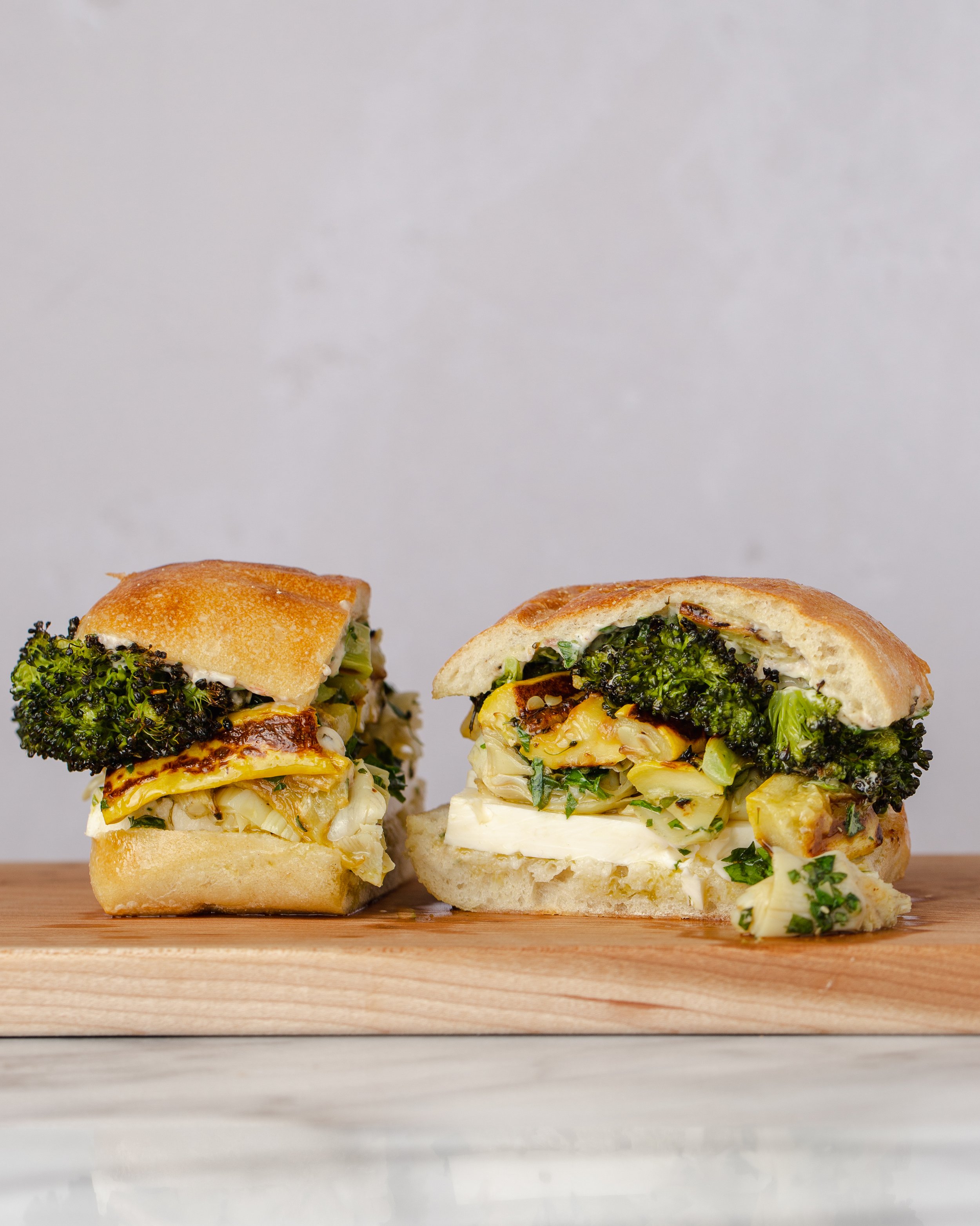 Roasted Broccoli and Summer Squash Sandwich with Artichokes, Feta, and Salsa Verde