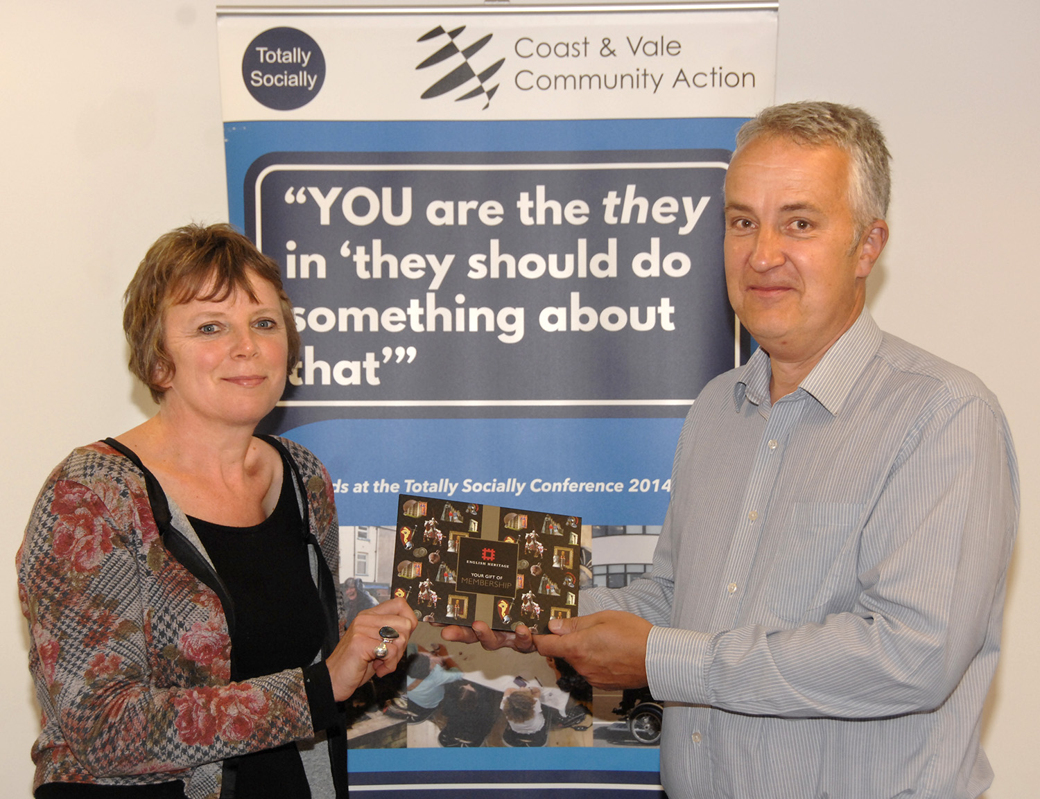 Lucy Wilkins accepts her English Heritage membership from David Stone (to order photos ring 353597)