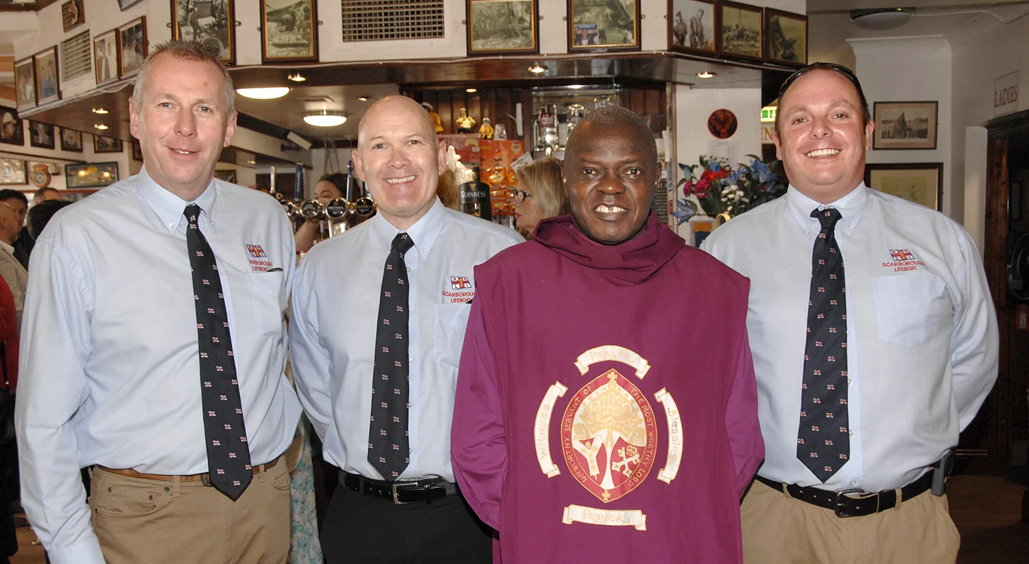 The archbishop with, L-R, Dave Horsley, Pete Billingsley and Kev Roberts of Scarborough RNLI