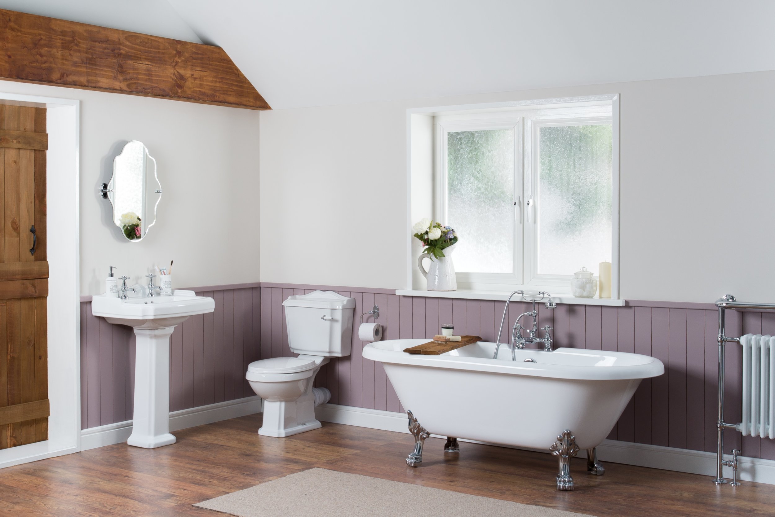 elegant-bathroom-interior-with-luxury-vintage-bathtub-pedestal-sink-with-mirror-toilet.jpg
