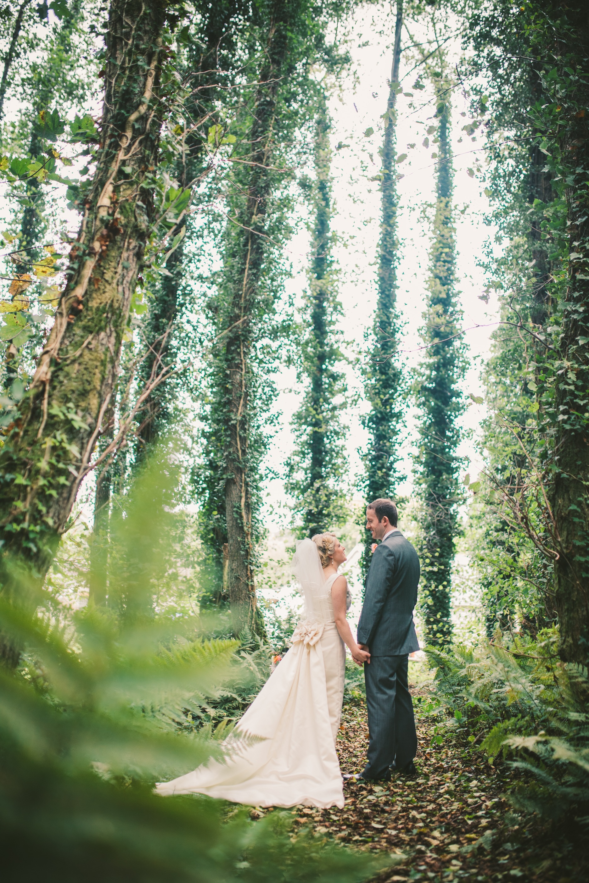 I had no idea what I wanted my wedding dress to look like. Not the first clue. I guess I always knew that it would be an act of fate that led me to find the perfect dress- the ONE- as so many people had told me. And that's exactly what happened. I heard about a new bridal shop opening up in Penarth and as I was working just around the corner, I decided to pop in and see if it had anything to offer. Rachel Burgess Bridal Boutique had SO much to offer! A gorgeous elegant boutique, filled with Rachel's personality and passion. Rachel was so welcoming and full of fun, I knew immediately that this little shop would give my mum and I the dress shopping experience we had been waiting for. I booked an appointment there and then for the following week. After coffee and cake and a morning of trying on every dress in the shop, I had found Rose. The One. A vintage dress that was everything I didn't even realise I'd been dreaming of! I loved this dress. Given the name 'Rose' by Rachel (she names all her dresses!), due to the flower design featured on the back, it was different to any wedding dress I had seen before. 'She' had a 6 ft detachable train- wow! Rachel helped and advised on veils and accessories, and between us we decided on a bespoke birdcage veil to be designed by Claire Hill. We then added a handmade traditional veil along the way to complete the look. I left the shop on cloud nine and it didn't stop there. Every fitting at the Boutique was filled with chat and fun and lots of advice! I can honestly say that walking into that new little shop in Penarth that day enriched my whole wedding experience. I felt wonderful in my dress on the day, so comfortable, so me! And Rachel gave me the confidence to go for it and just be ME. Photo by: Simon Gough Photography