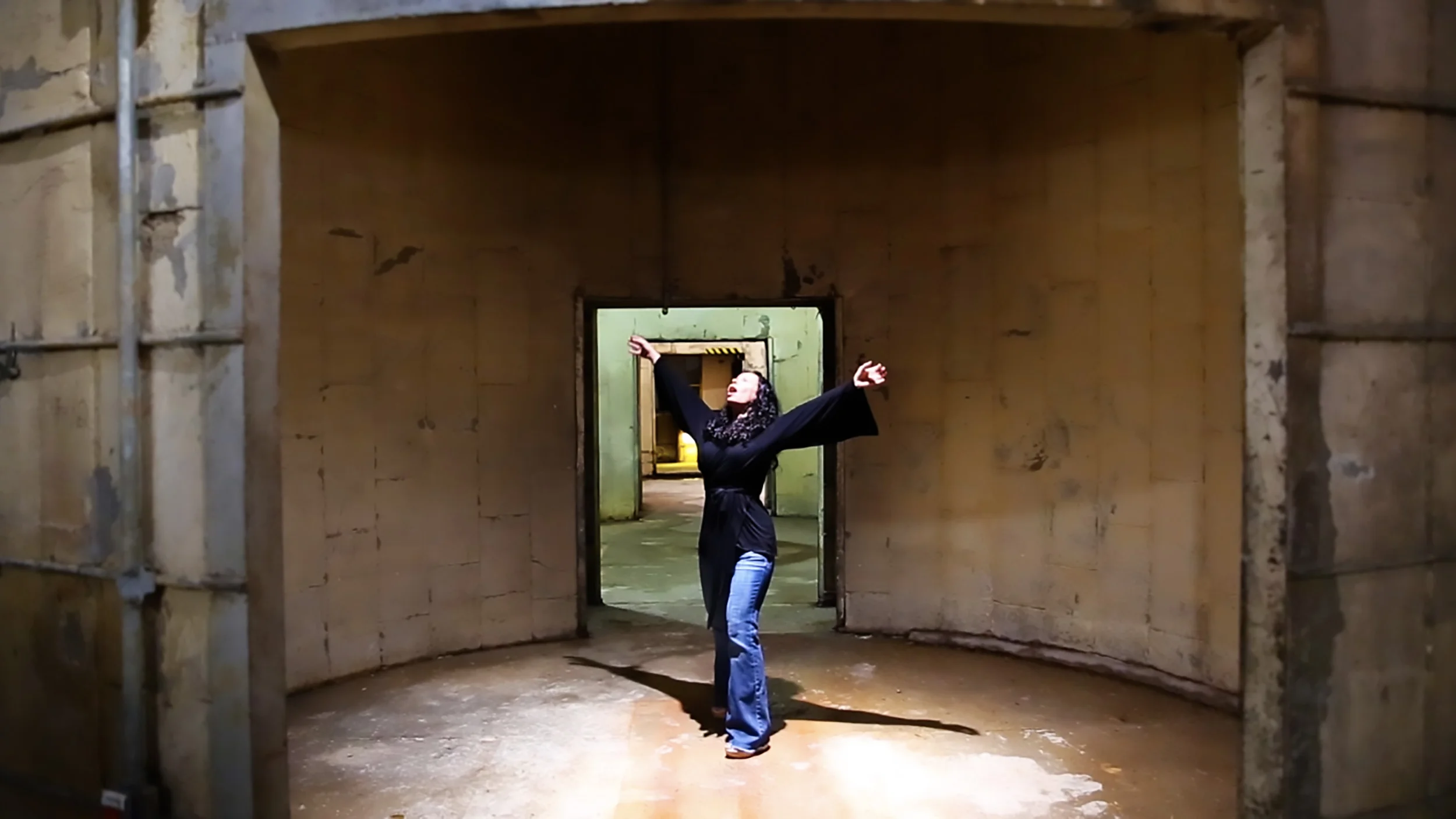 Singing up into the magnifiscent Silos at Sawyer Yards. Houston, Texas. Misha Penton. Rehearsal for Threshold.