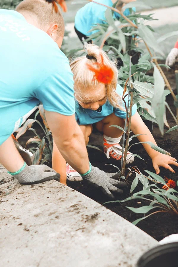 children gardening with adults.jpg
