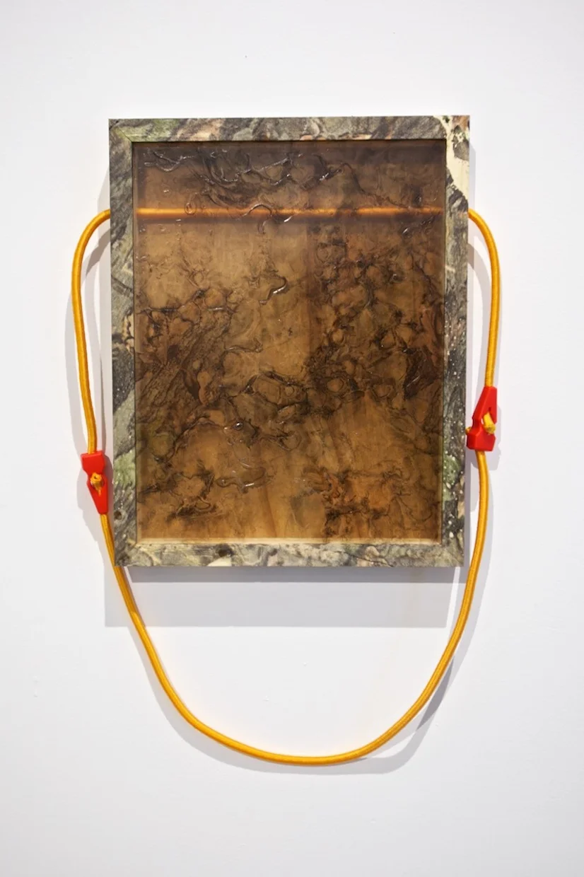  Time keeps me warm, 2015 Hydroprinted wood and bungee cord Dimensions variable 