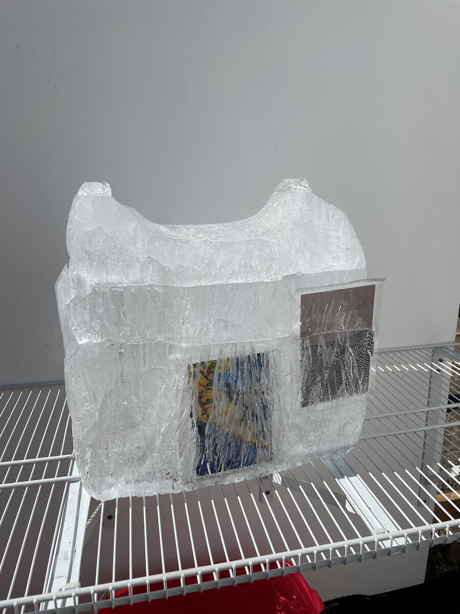  Untitled (ice sculpture/cast cooler), 2021 Ice and scans printed on photo paper 18 x 20 x 15 inches  Documentation of melting ice sculpture.  Sculpture melted over 5 hours to free the printed paper originally frozen into cooler sculpture. 