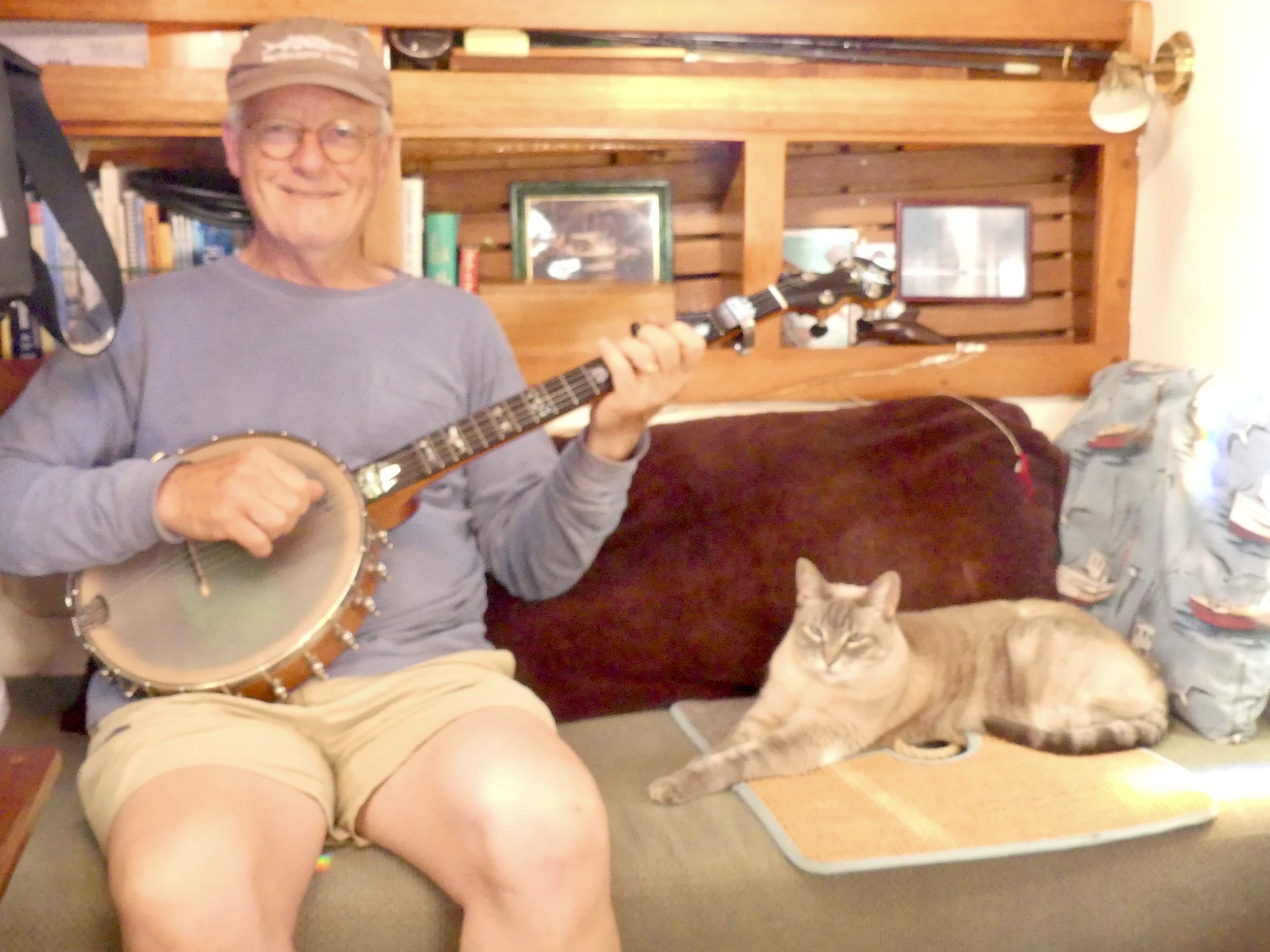 Ship's cat enjoy's banjo