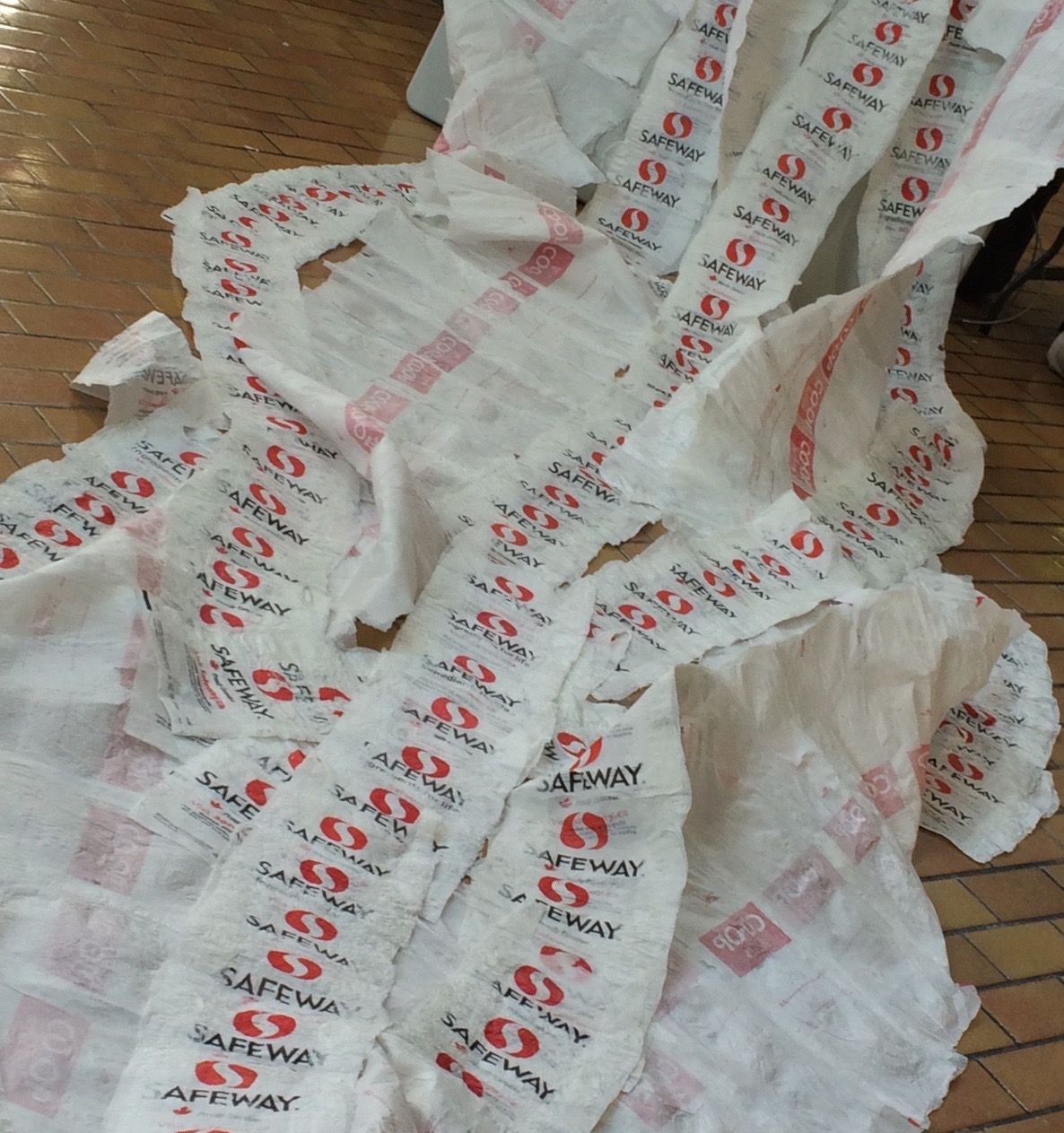 Safeway bags fused together creating a cascade of flowing plastic.